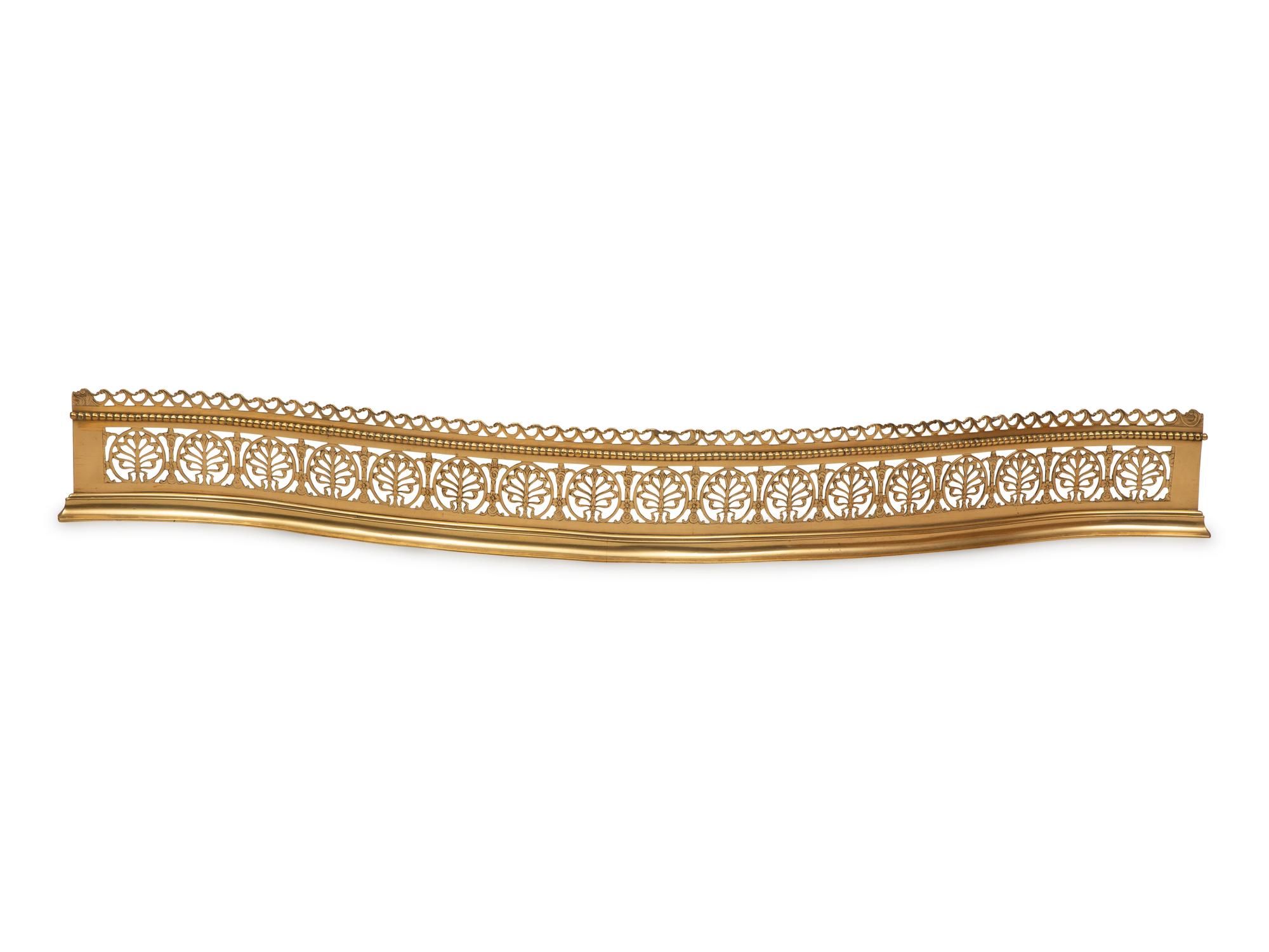 An Irish Pierced Brass Serpentine Fire Fender