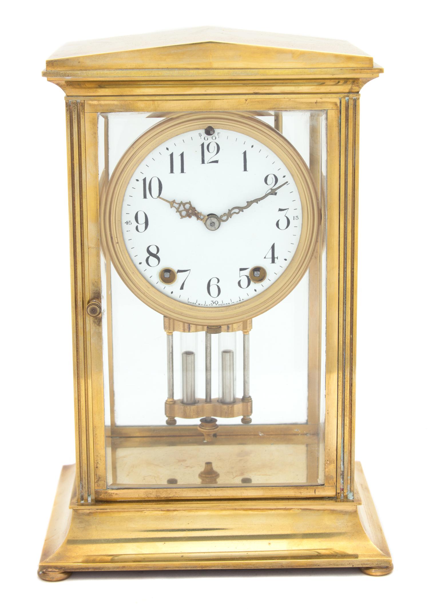 A Seth Thomas Empire Style Brass Mantle Clock Height 11 1/4 inches.
