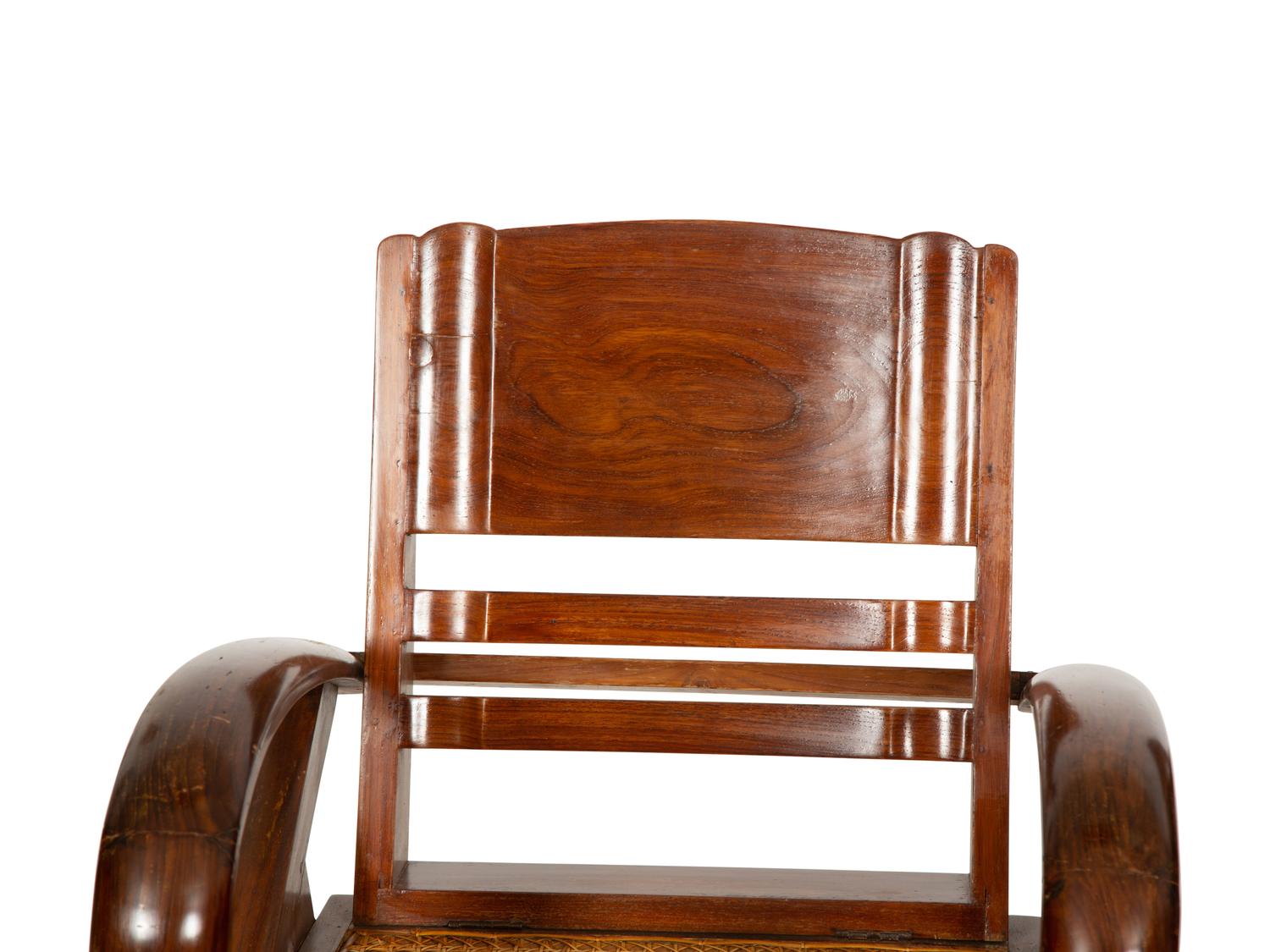 A Pair of Art Deco Walnut and Caned Folding Lounge Chairs