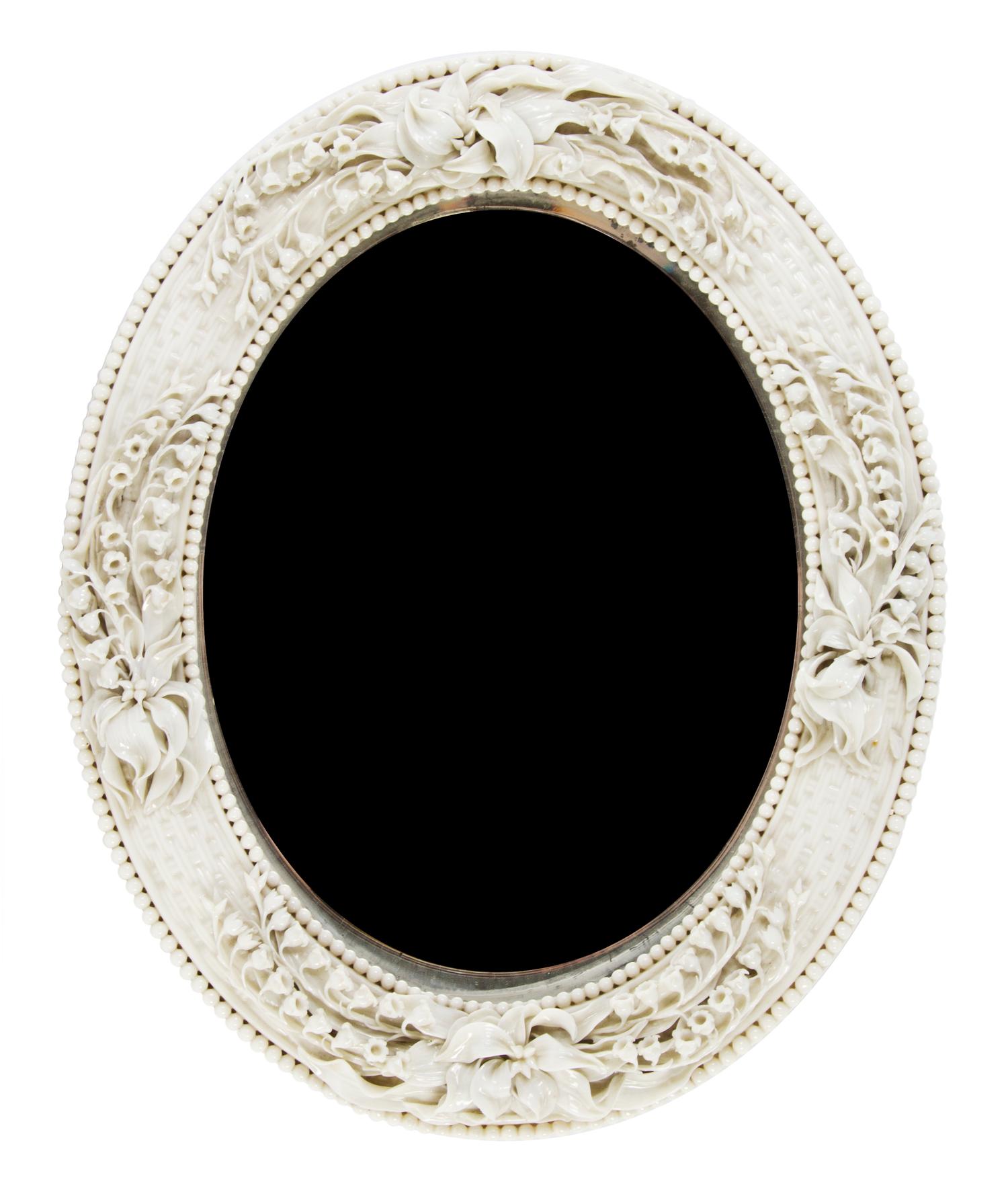 A Belleek Lily of the Valley Mirror, Height 16 x width 13 inches.