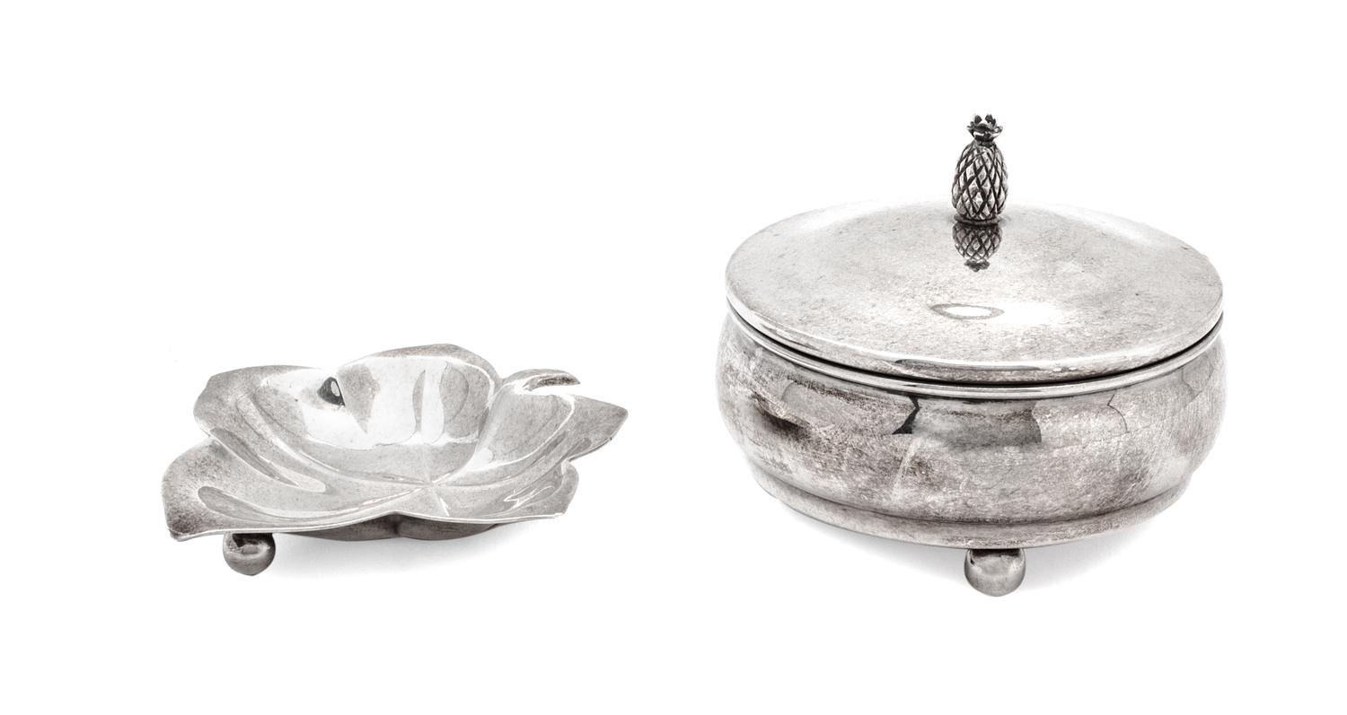 Two Silver Articles, Various Makers, comprising a Tiffany leaf-form footed dish and a Cartier covered circular box on ball feet