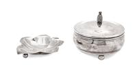 Two Silver Articles, Various Makers, comprising a Tiffany leaf-form footed dish and a Cartier covered circular box on ball feet
