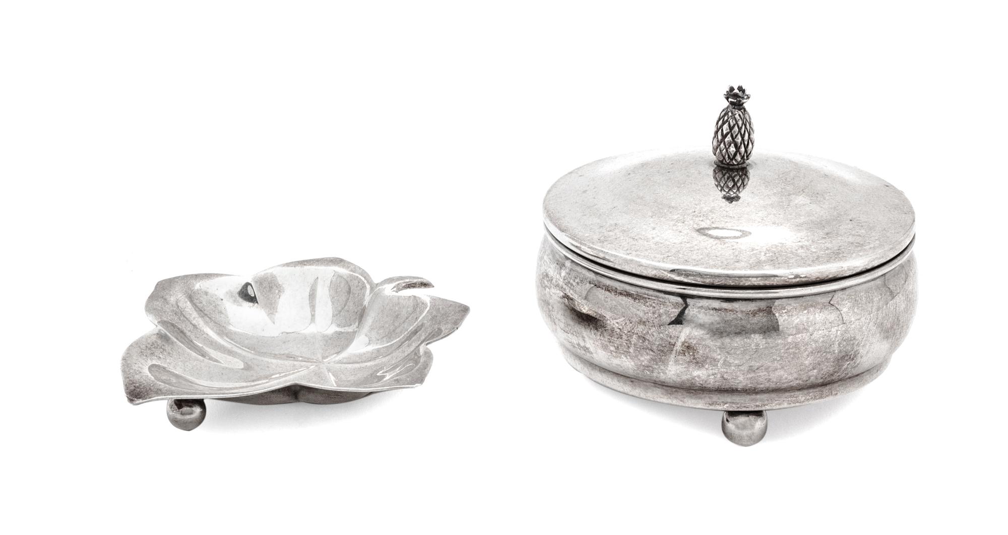 Two Silver Articles, Various Makers, comprising a Tiffany leaf-form footed dish and a Cartier covered circular box on ball feet