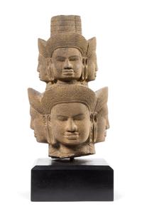 A Khmer Sandstone Head of Brahma — 14TH CENTURY