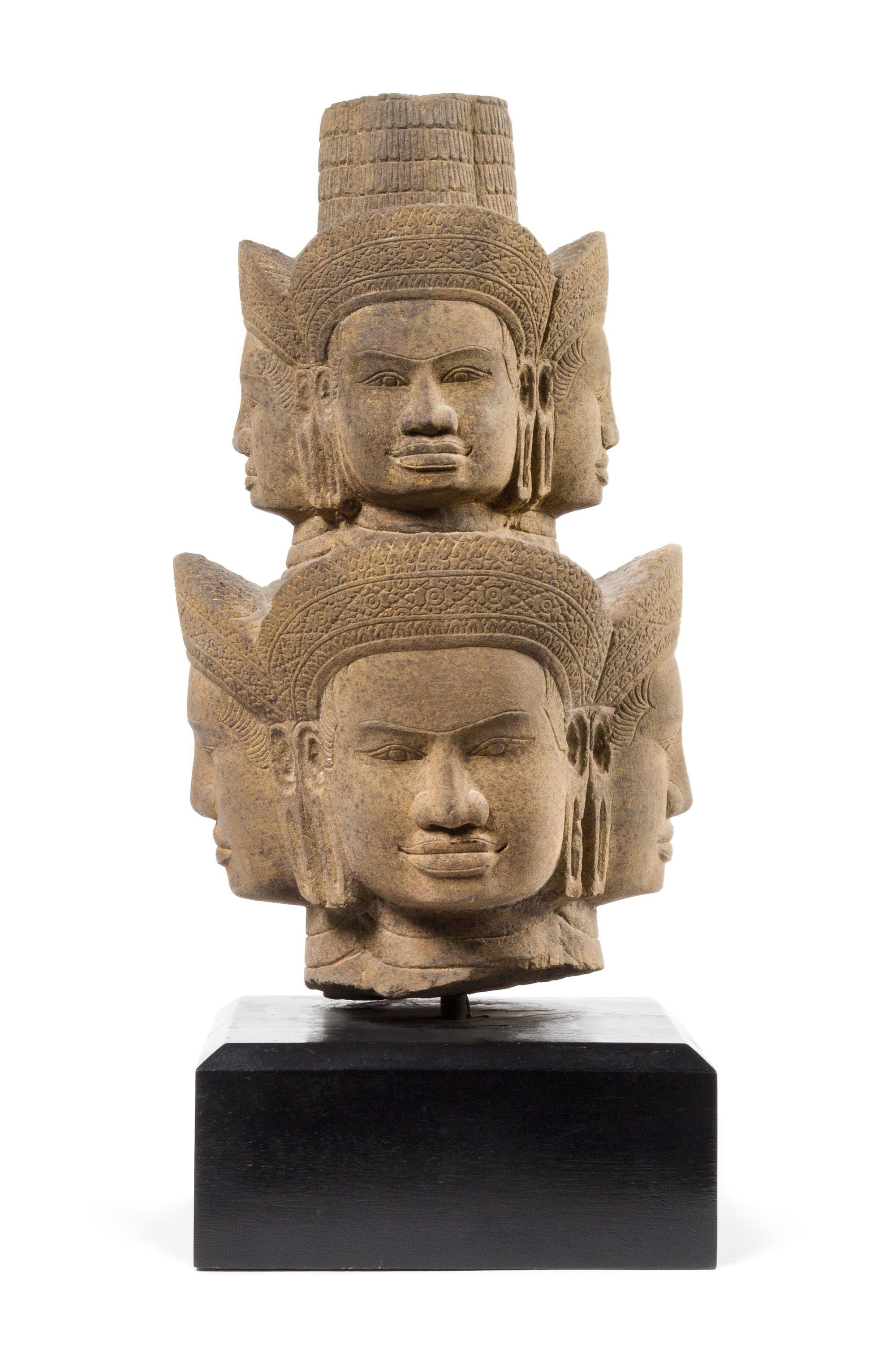 A Khmer Sandstone Head of Brahma — 14TH CENTURY