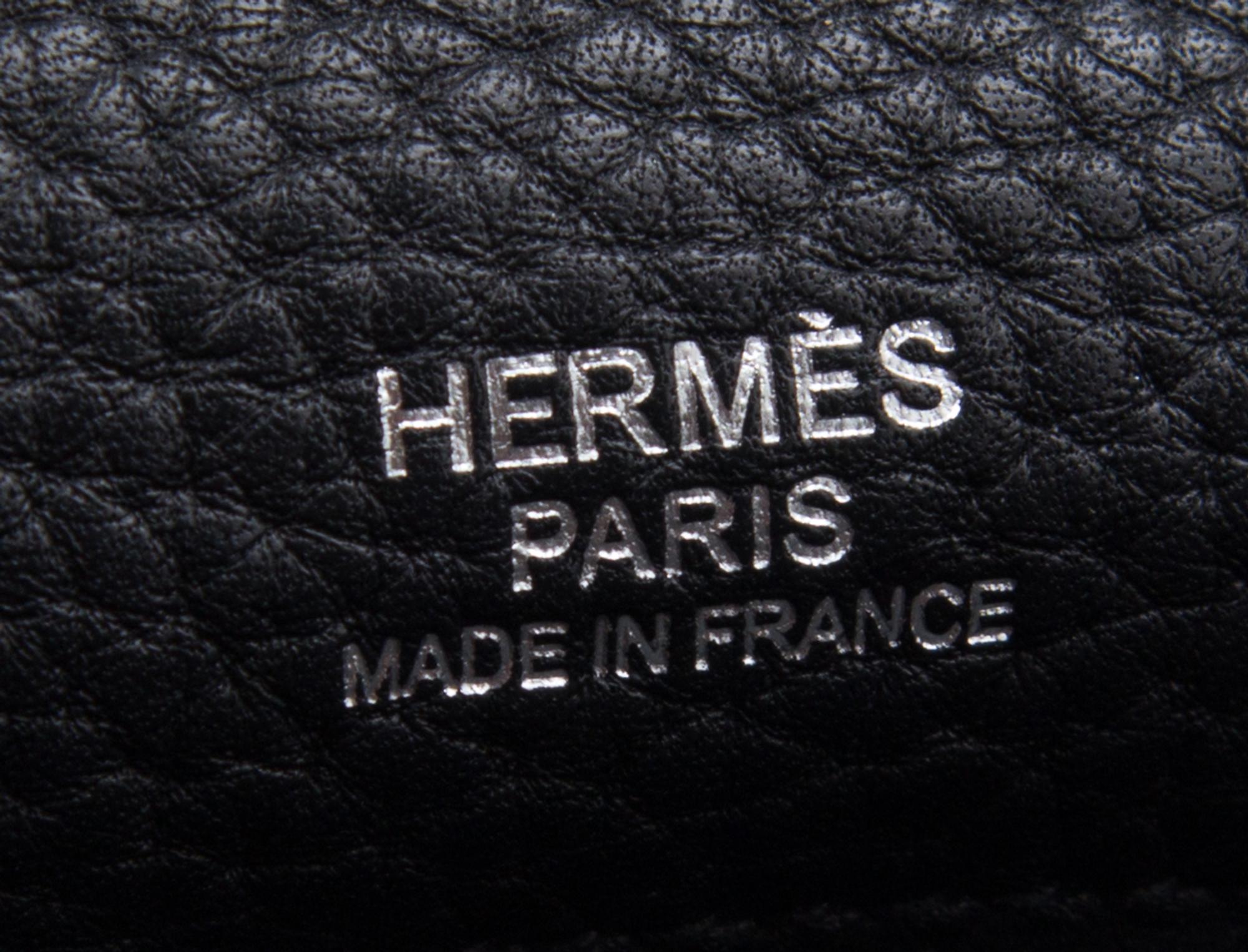 An Hermes Bicolor Noir and Bleu Indigo Swift and Taurillon Clemence 32cm Kelly Ghillies Handbag, 13" x 9.5" x 4.5".