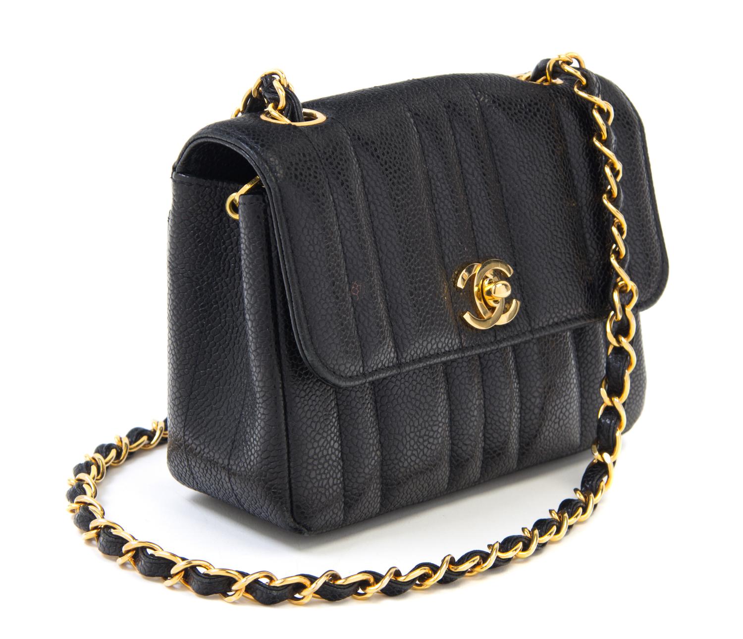 A Chanel Black Caviar Quilted Small Flap Bag, 7" x 5" x 2"; Strap drop: 21".