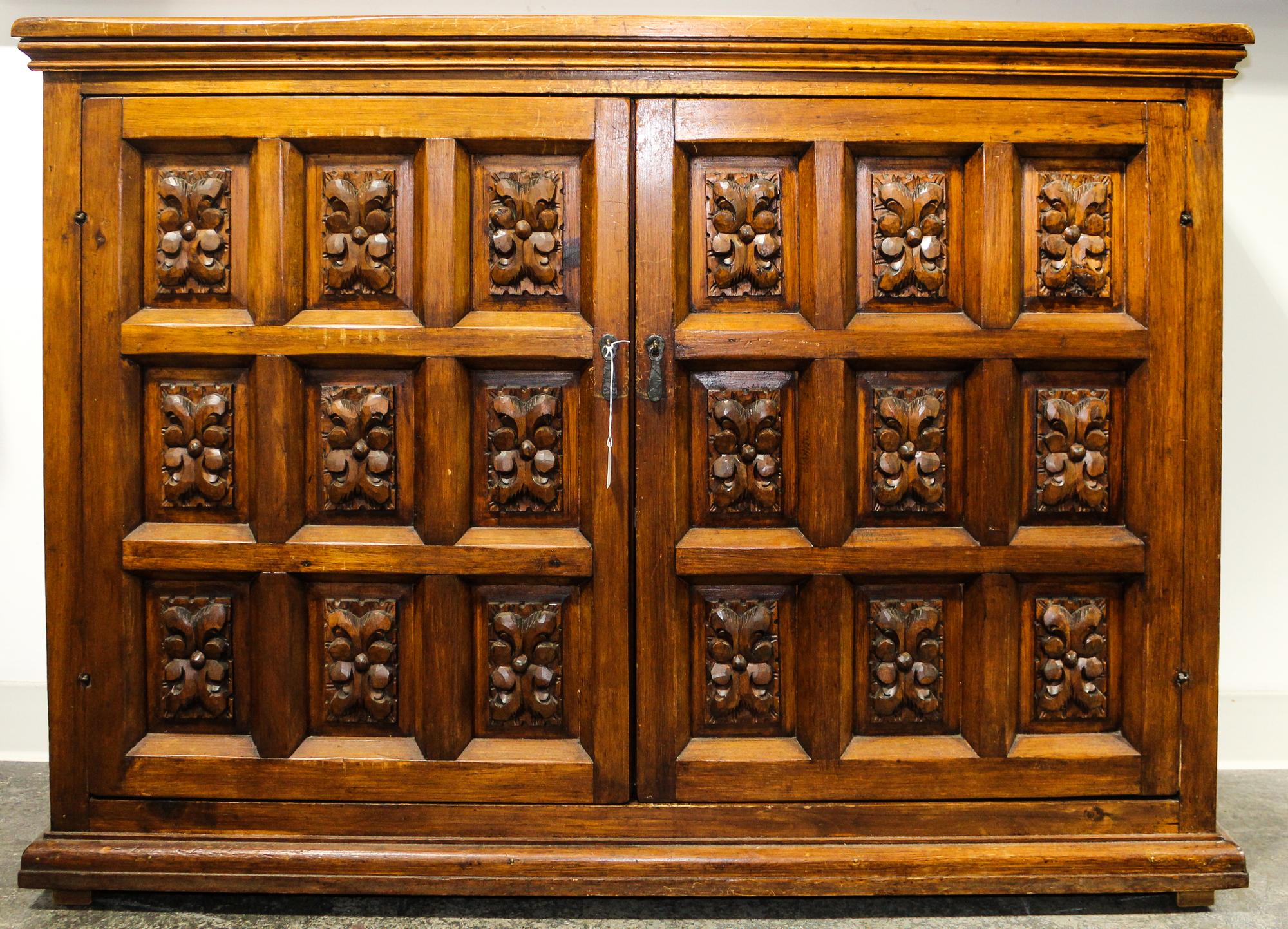 A Mexican Pine Cabinet Height 34 x width 49 1/2 x depth 16 1/2 inches.