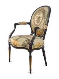 A George III Style Parcel Gilt and Ebonized Armchair