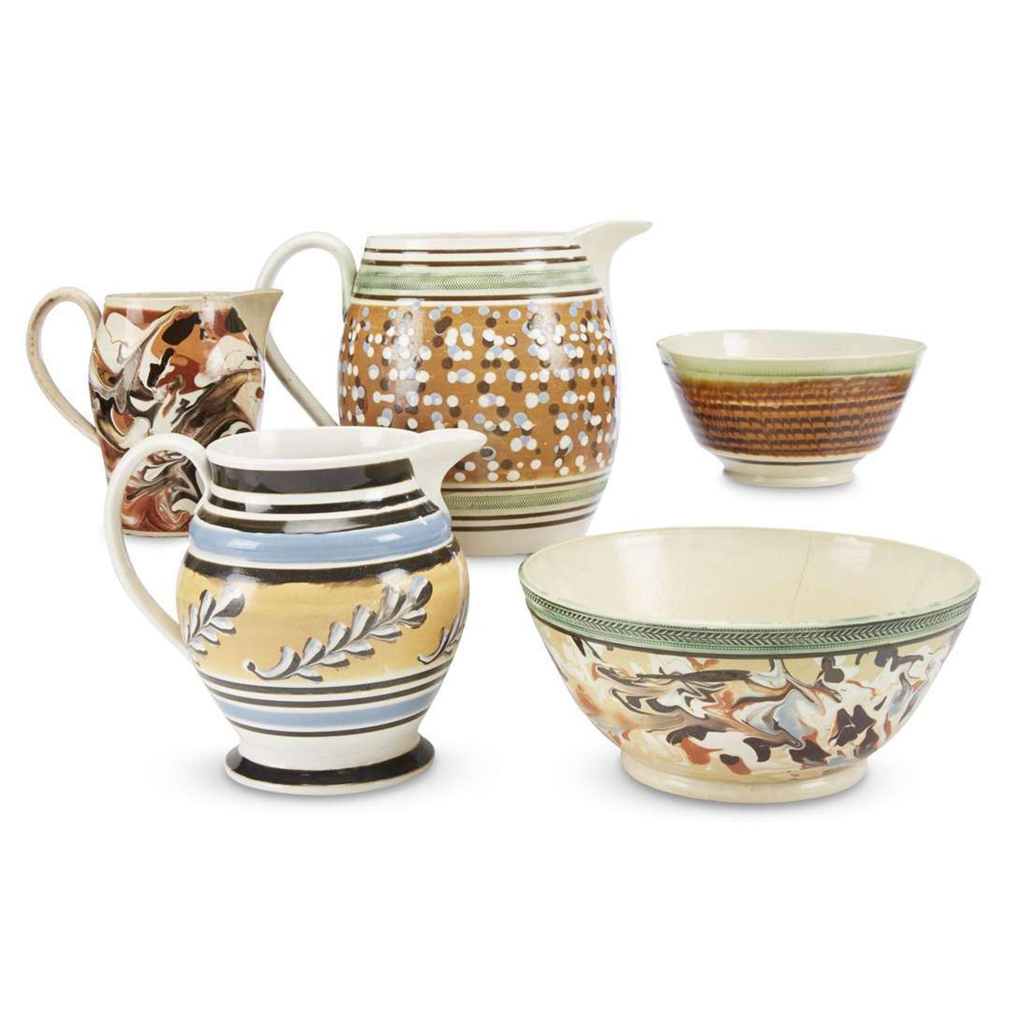 Group of five variously decorated Mochaware pitchers and bowls England, early 19th century