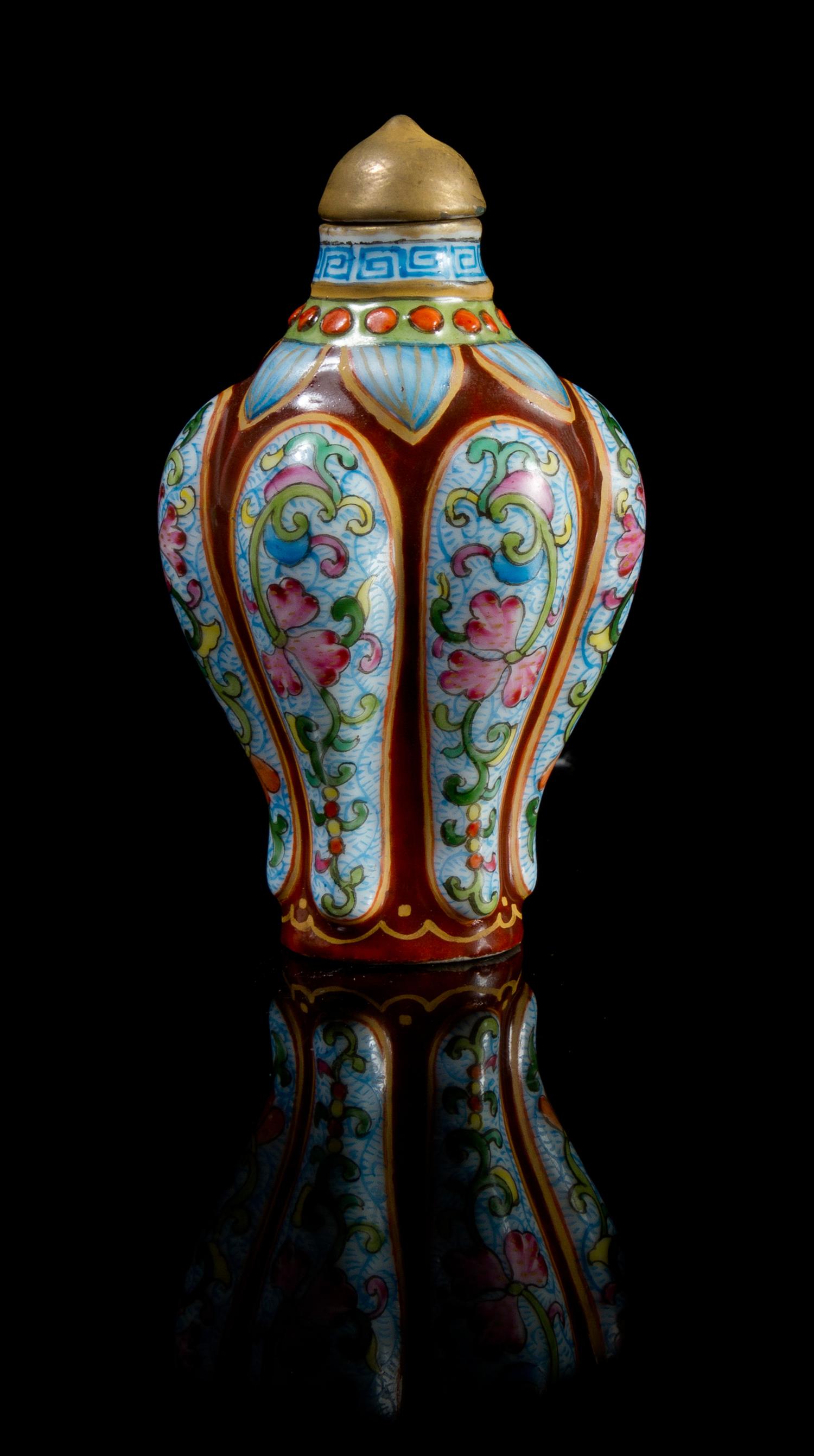 A Famille Rose Porcelain Snuff Bottle Height 2 7/8 inches.