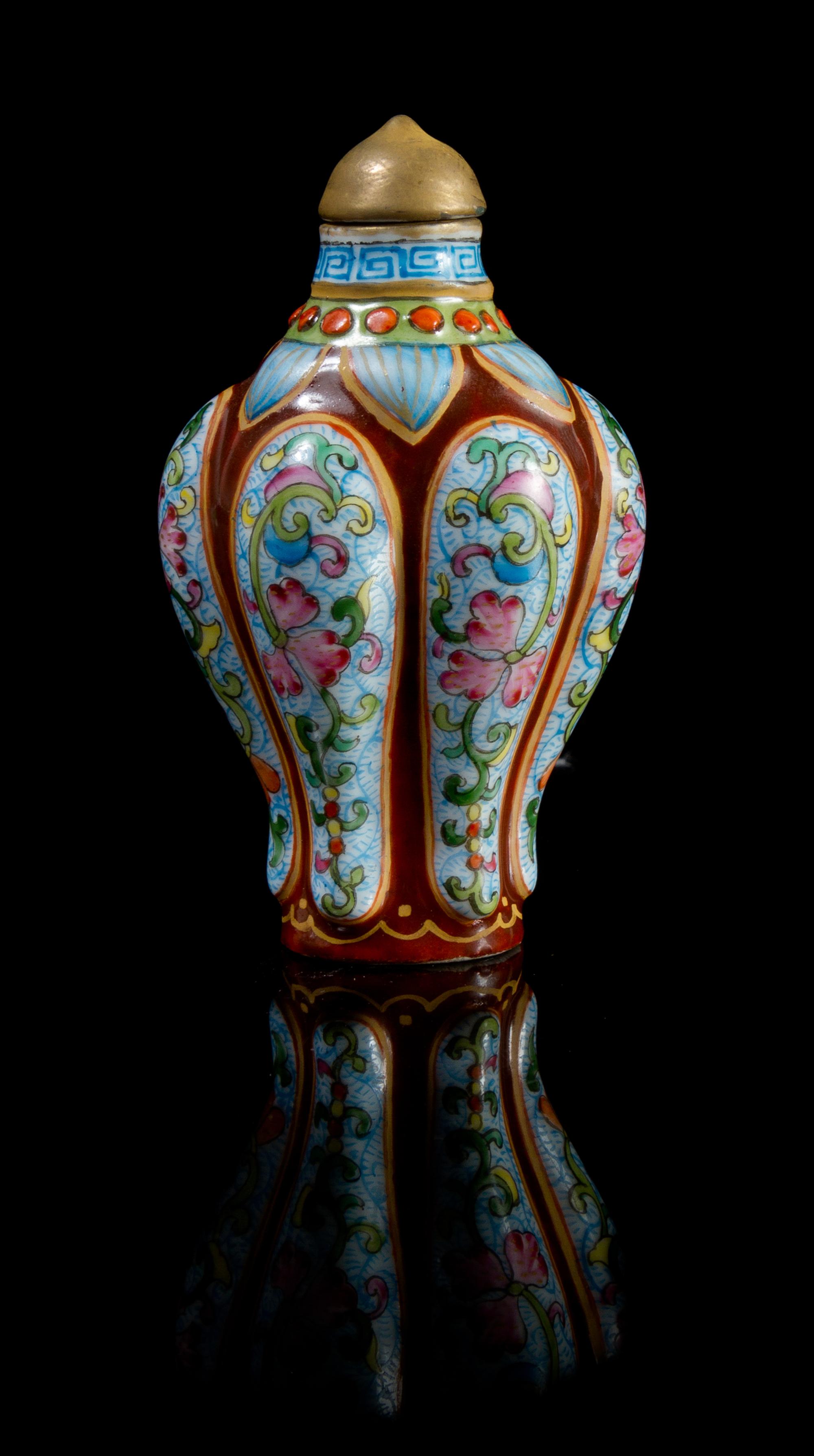 A Famille Rose Porcelain Snuff Bottle Height 2 7/8 inches.