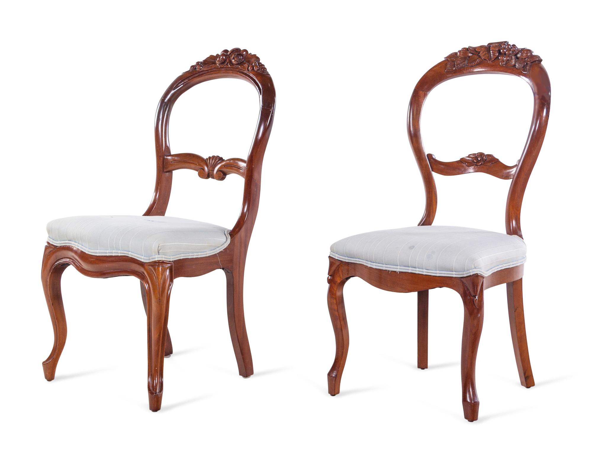 A Pair of Victorian Carved Walnut Side Chairs