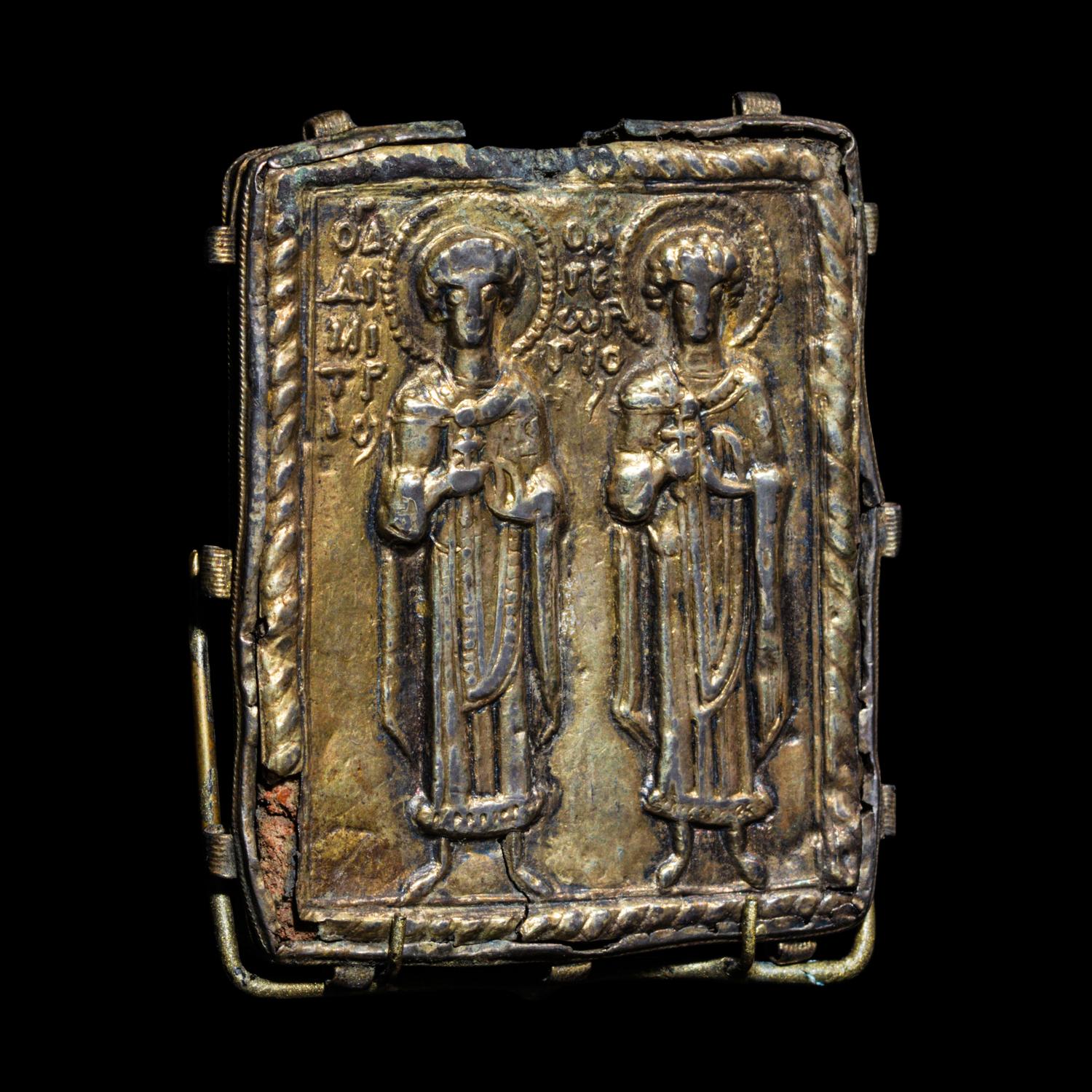 A Byzantine Gilt-Silver Enkolpion with Saints Demetrios and George