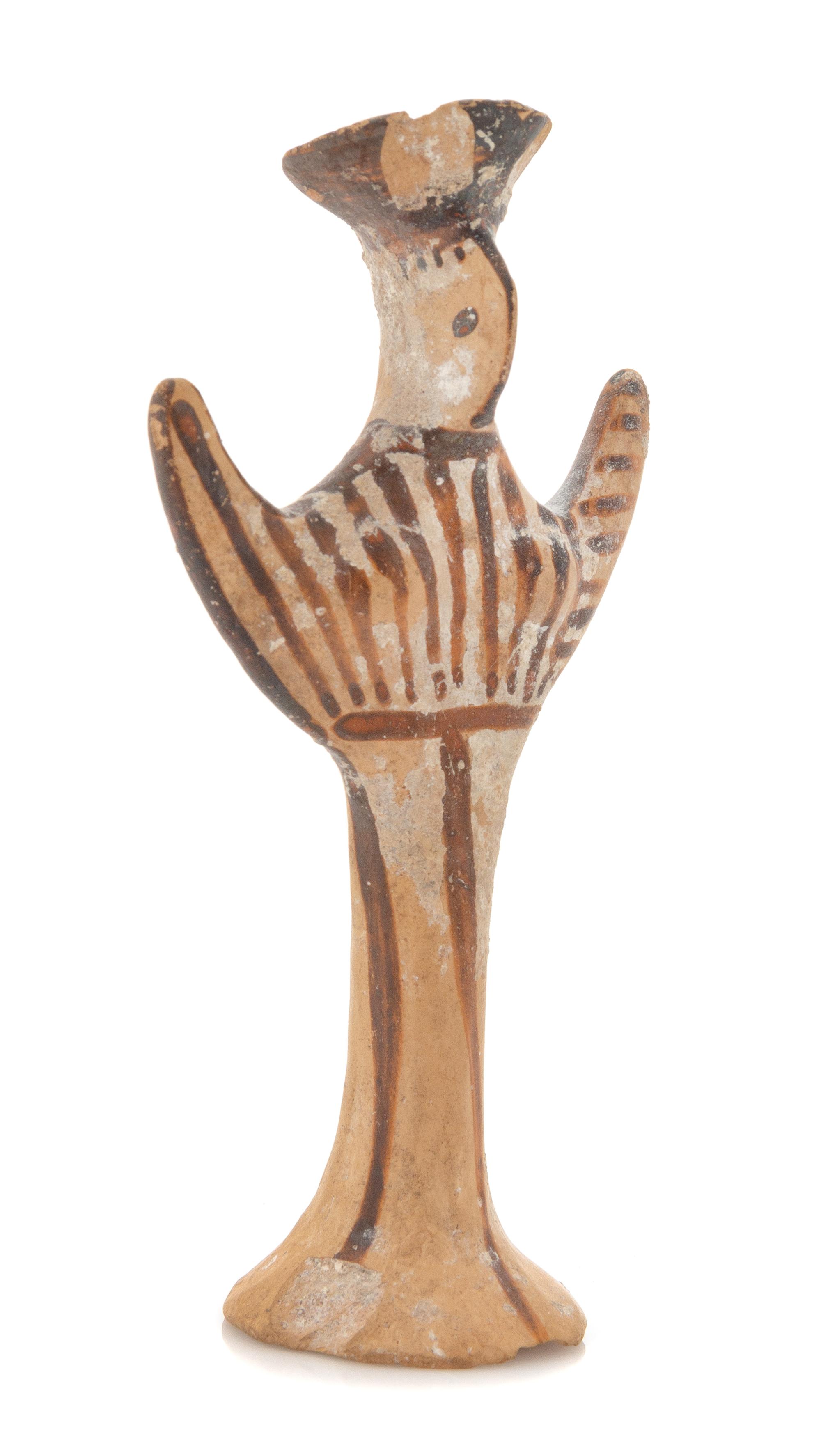 A Mycenaean Terra Cotta Psi Figure Height 4 1/8 inches. — CIRCA 1300-1200 B.C.E.