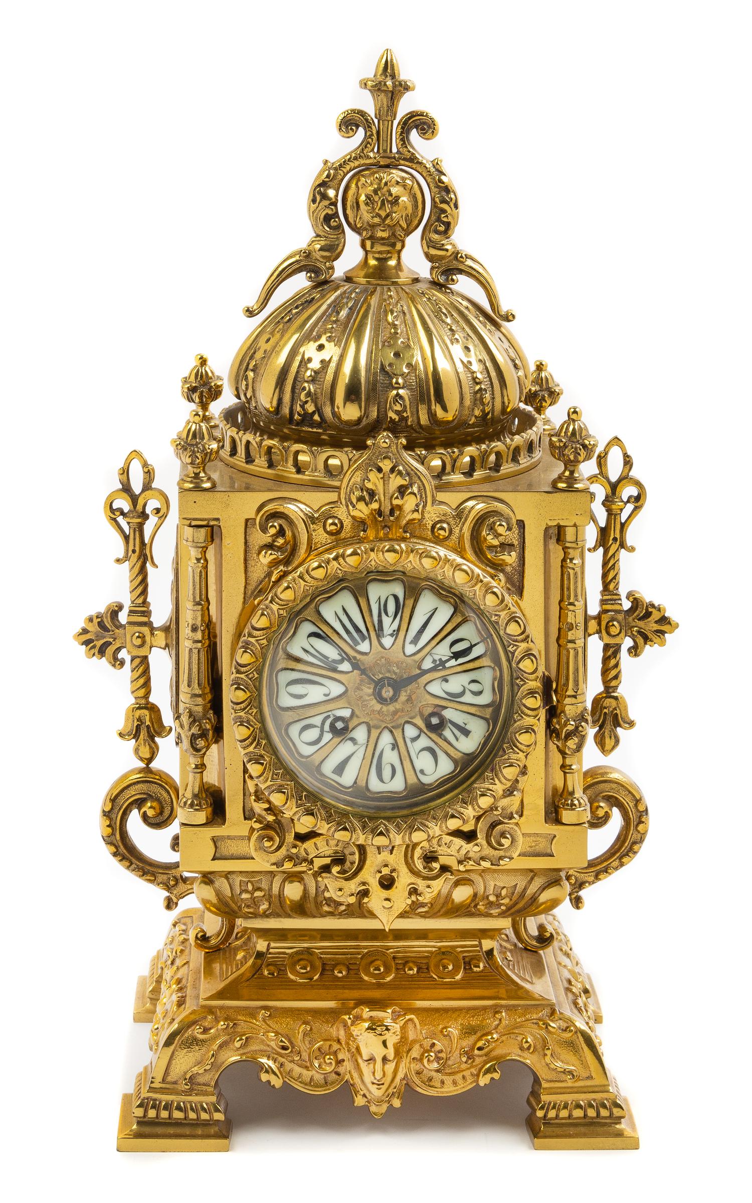 A Continental Neoclassical Style Brass Mantel Clock Height 18 x width 8 1/2 x depth 6 inches. — CIRCA 1900
