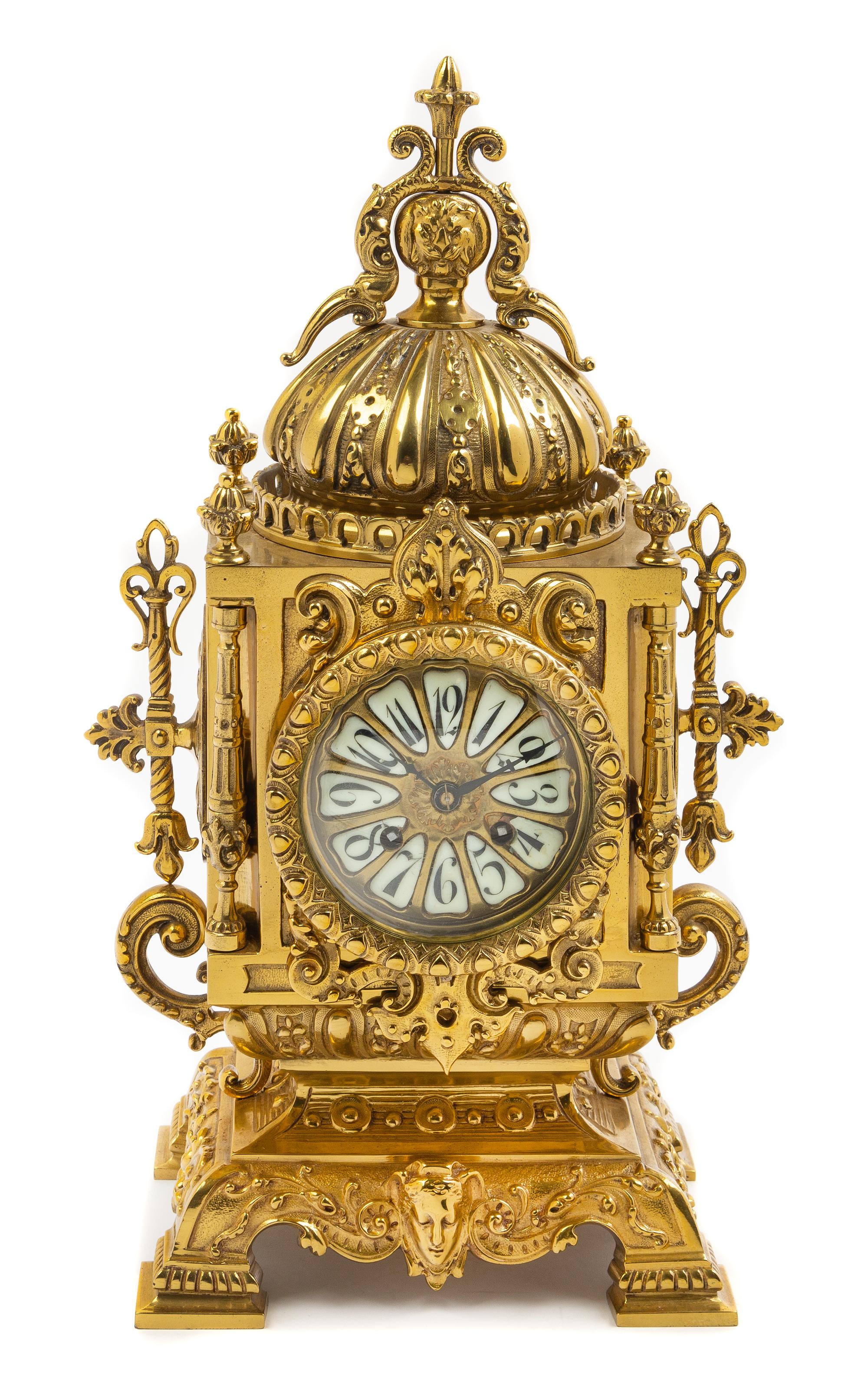 A Continental Neoclassical Style Brass Mantel Clock Height 18 x width 8 1/2 x depth 6 inches. — CIRCA 1900