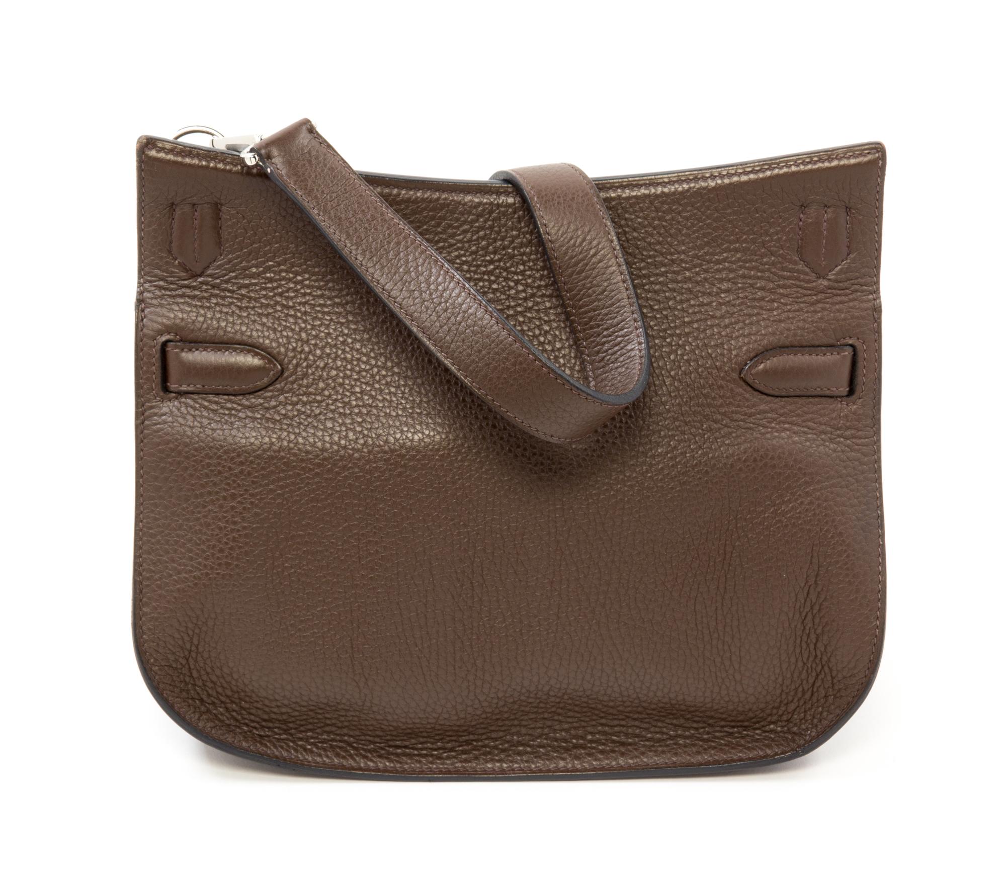 An Hermès Chocolate Taurillon Clemence Jypsiere 28cm Bag, 11" x 8.5" x 5".