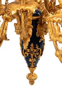 A French Neoclassical Gilt and Patinated Bronze Twelve-Light Chandelier