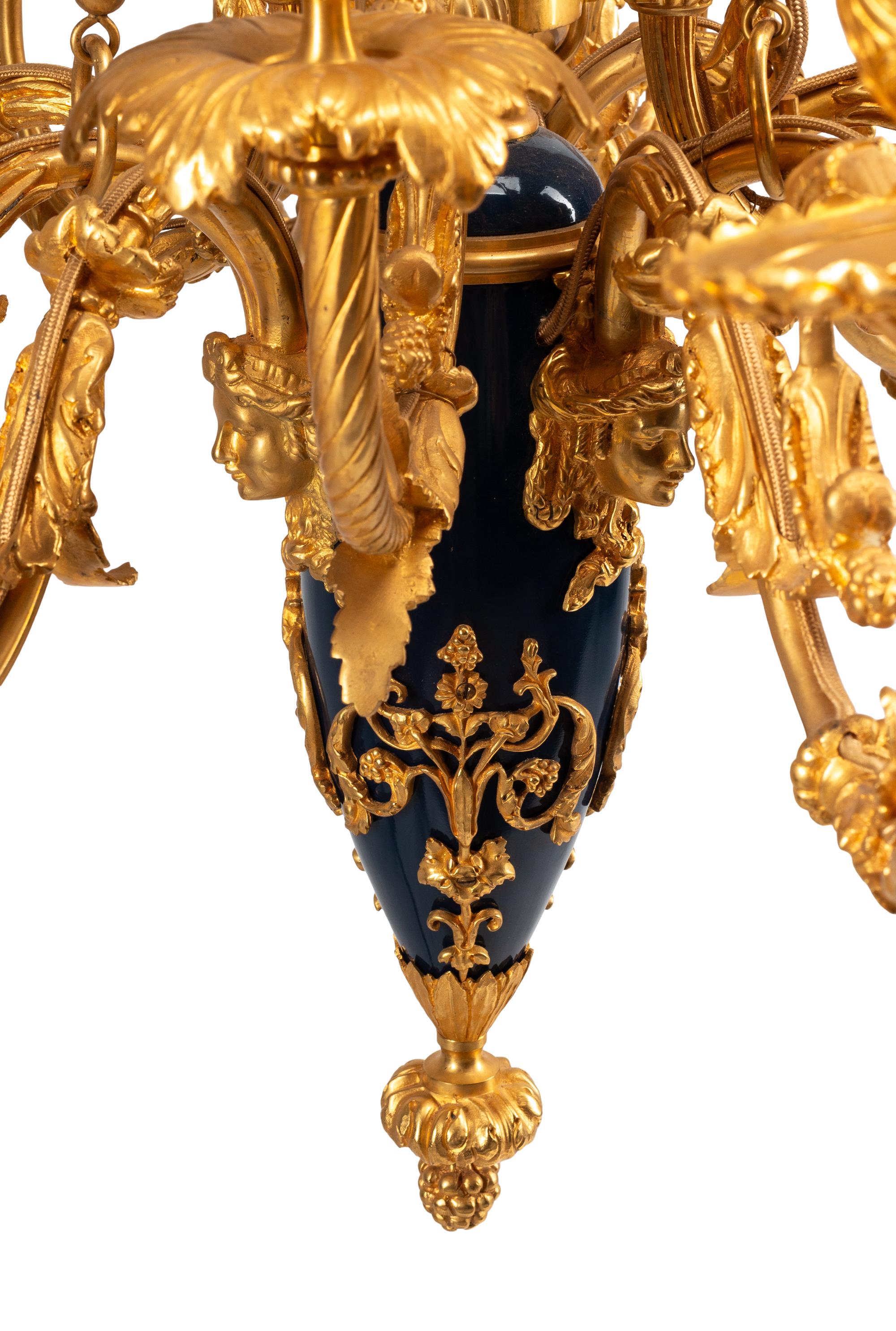 A French Neoclassical Gilt and Patinated Bronze Twelve-Light Chandelier