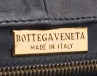 A Bottega Veneta Black Intrecciato Clutch, 11" x 8" x 1.5".
