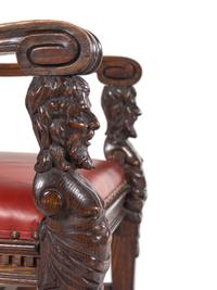 A Set of Eight R.J. Horner Carved Oak Man of the Mountain Dining Chairs