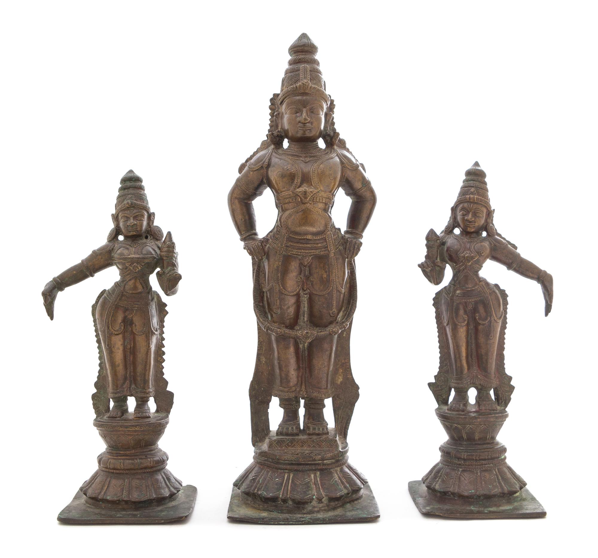 An Indian Bronze Triad of Vishnu with Consorts Height of tallest 16 1/4 inches. — 19TH CENTURY