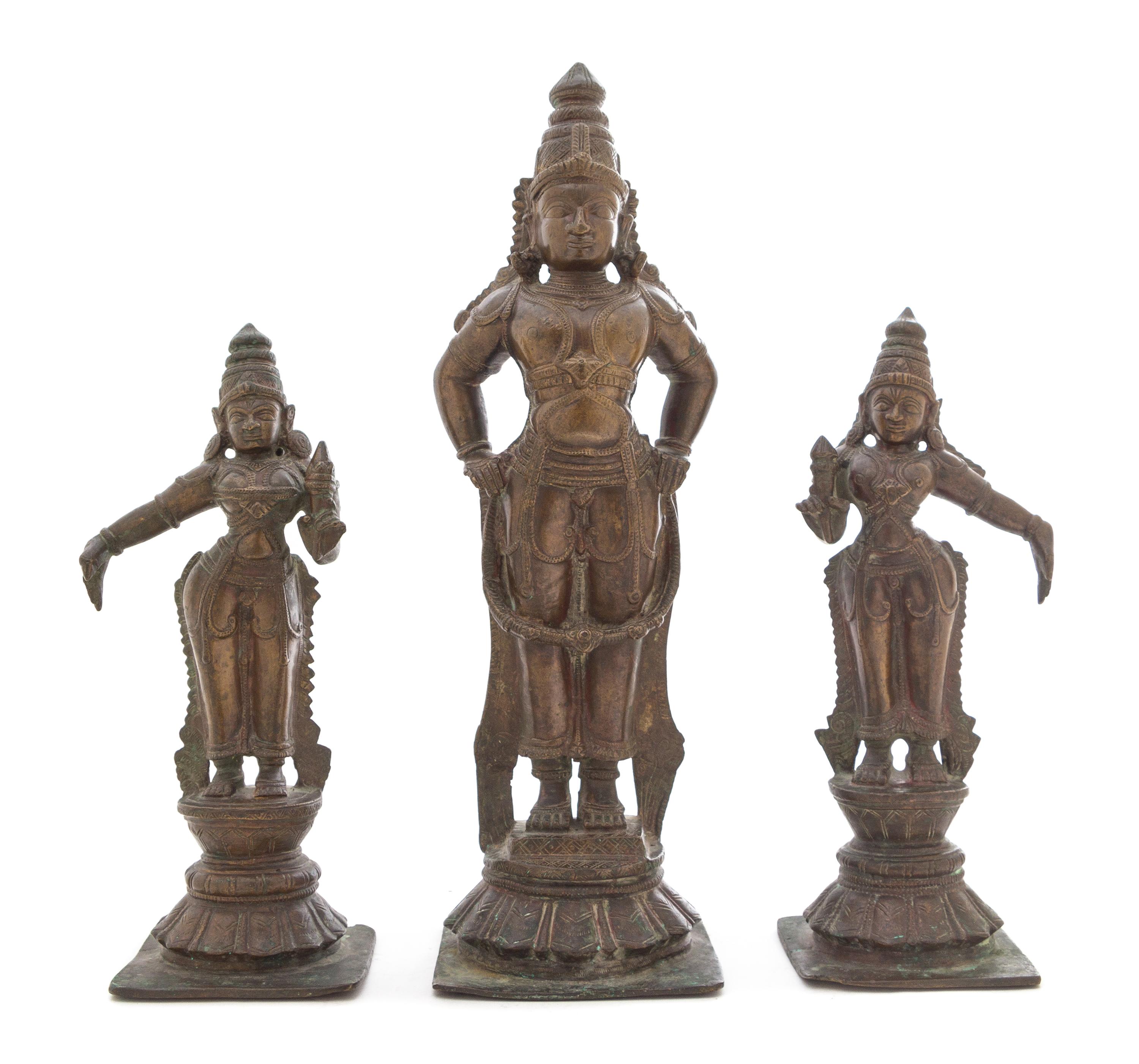 An Indian Bronze Triad of Vishnu with Consorts Height of tallest 16 1/4 inches. — 19TH CENTURY