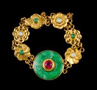 A Jadeite, 22 Karat Gold, Opal and Red Stone Bracelet Diameter 2 1/2 inches.