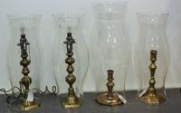 Two Pairs of Brass Candlesticks Height of taller pair 9 3/4 inches. — 19TH CENTURY