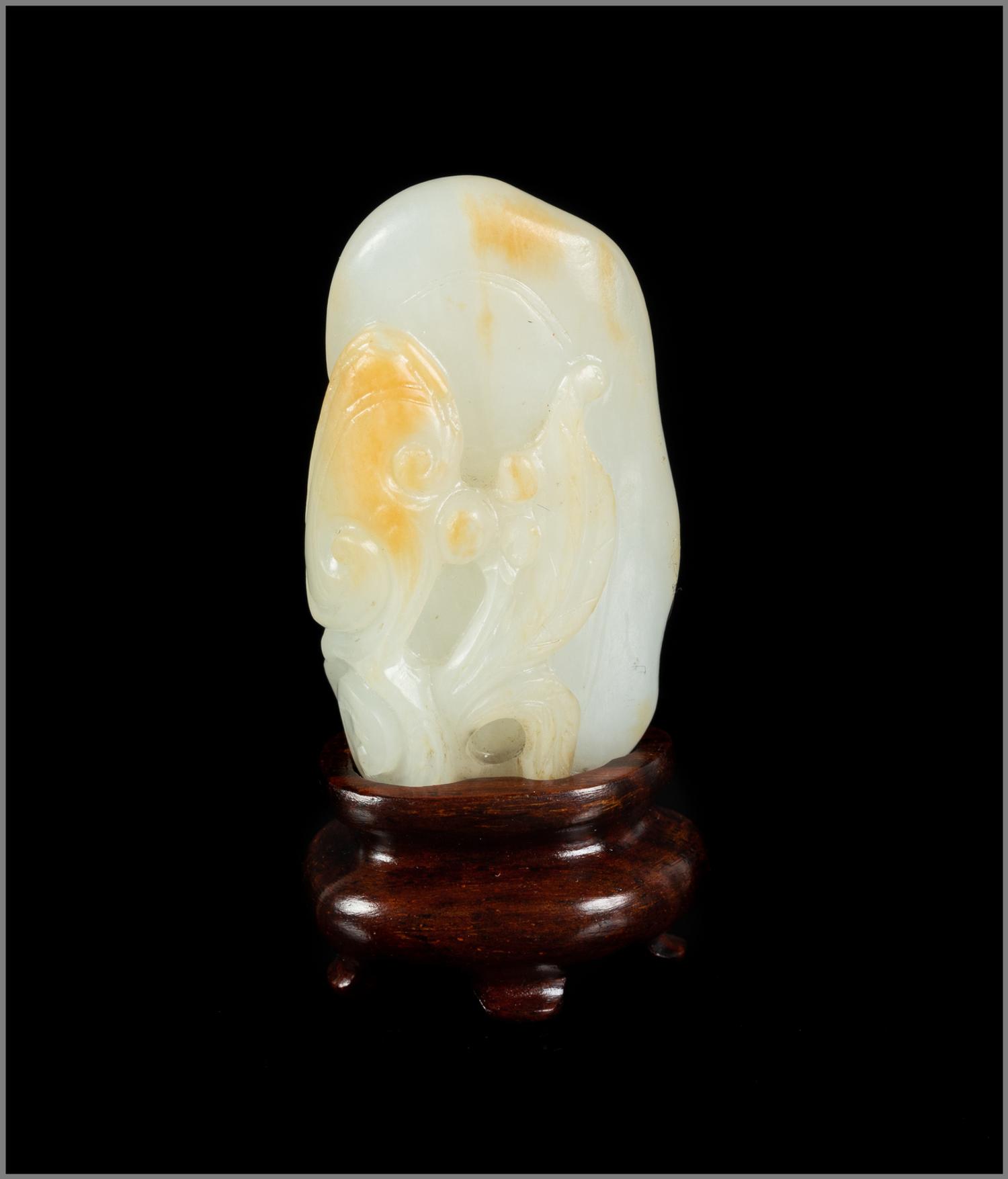 A Chinese Russet and White Jade Carving of Lingzhi