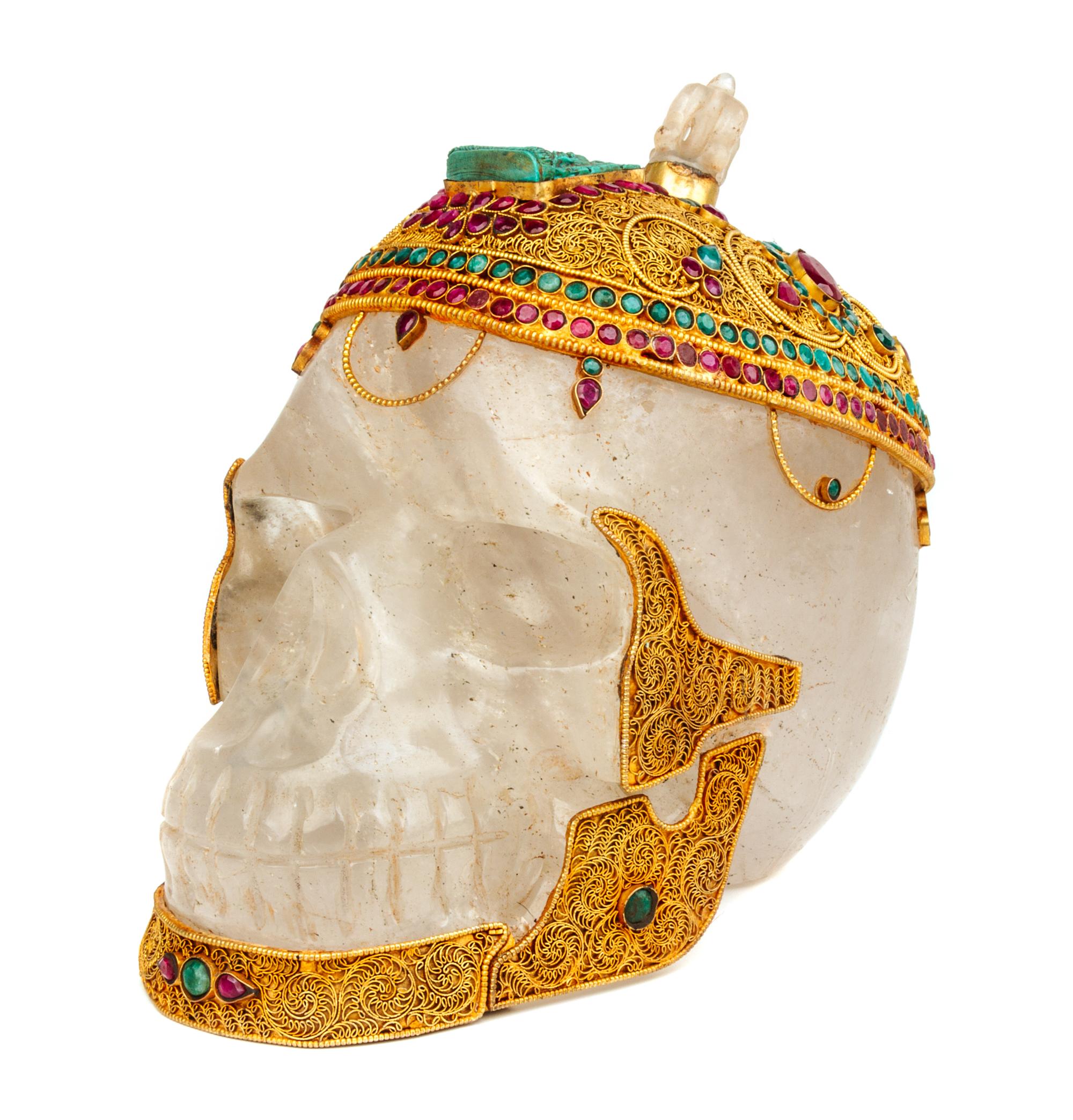 A Mughal Style Gilt Metal and Stone Inset Rock Crystal Skull Height 8 1/2 inches. — 20TH CENTURY