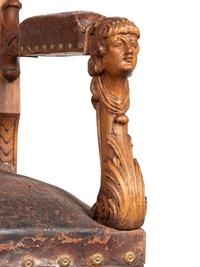 An Austrian Carved Walnut Bench with Tooled Leather Upholstery