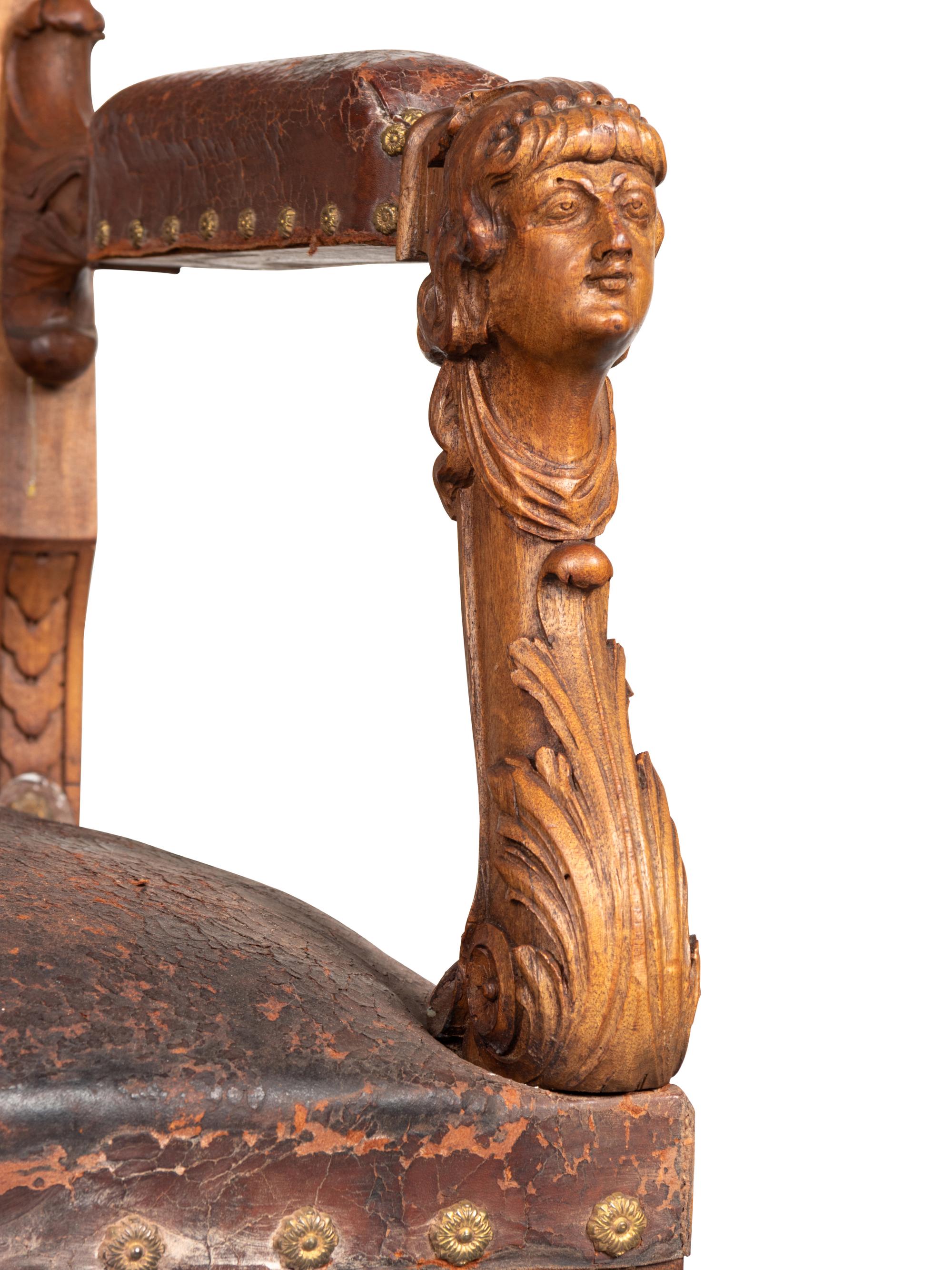 An Austrian Carved Walnut Bench with Tooled Leather Upholstery