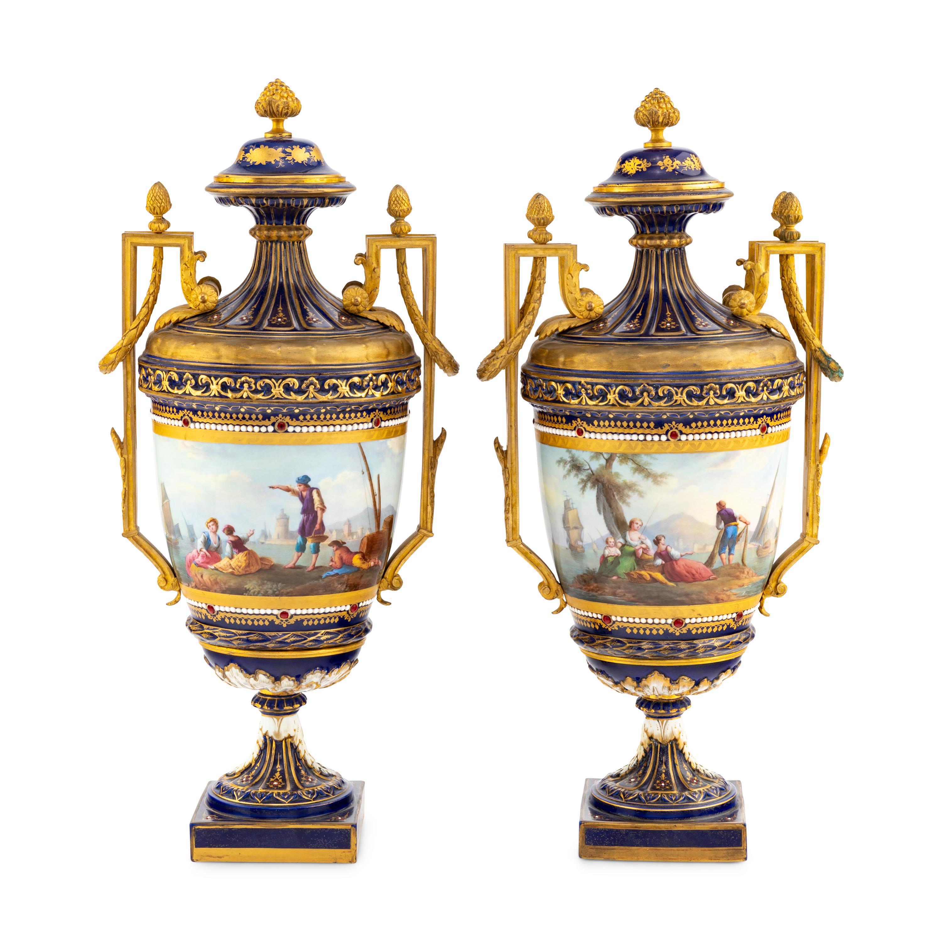 A Pair of Sèvres Style Gilt Bronze Mounted Porcelain Urns