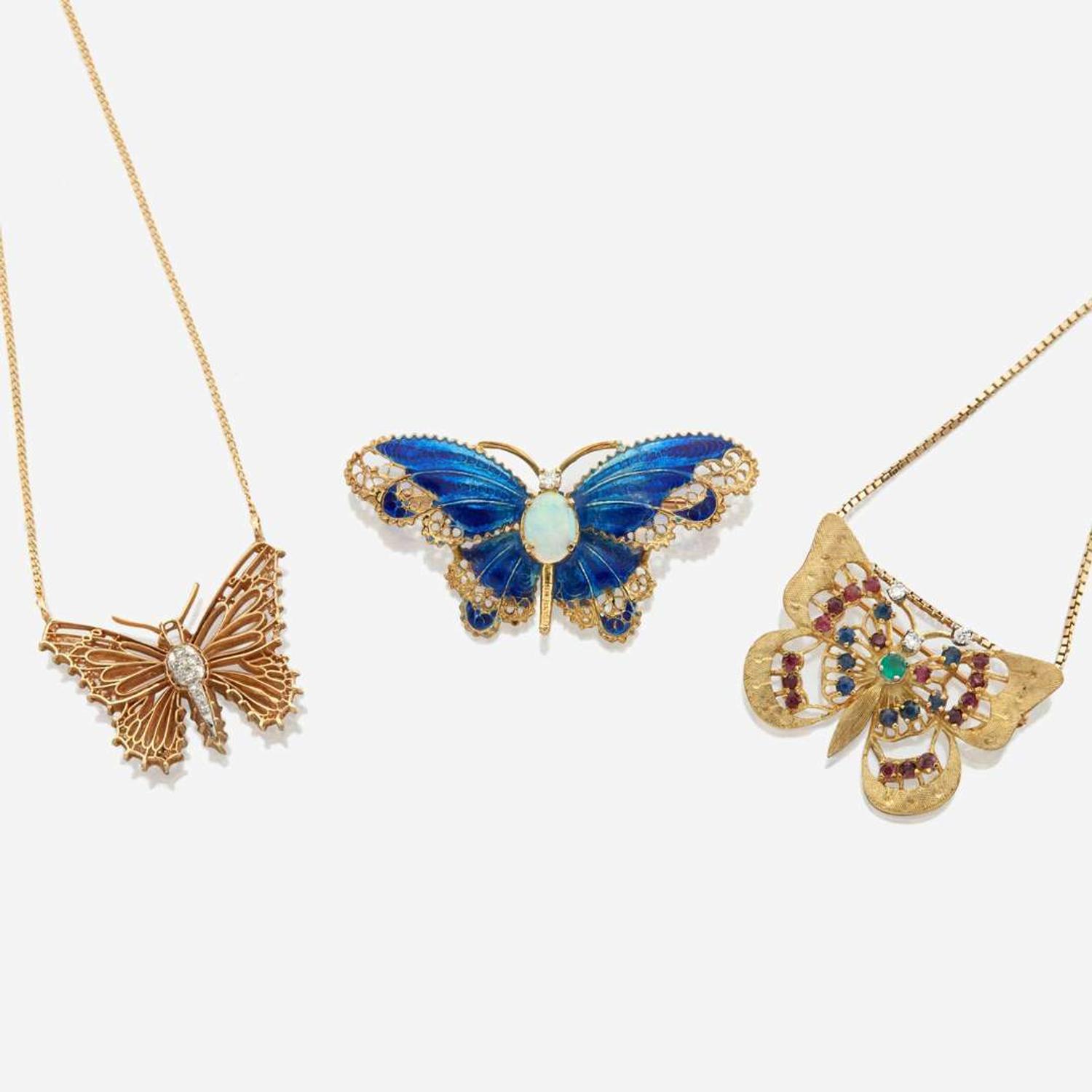 A collection of three pieces of gold and gem set jewelry