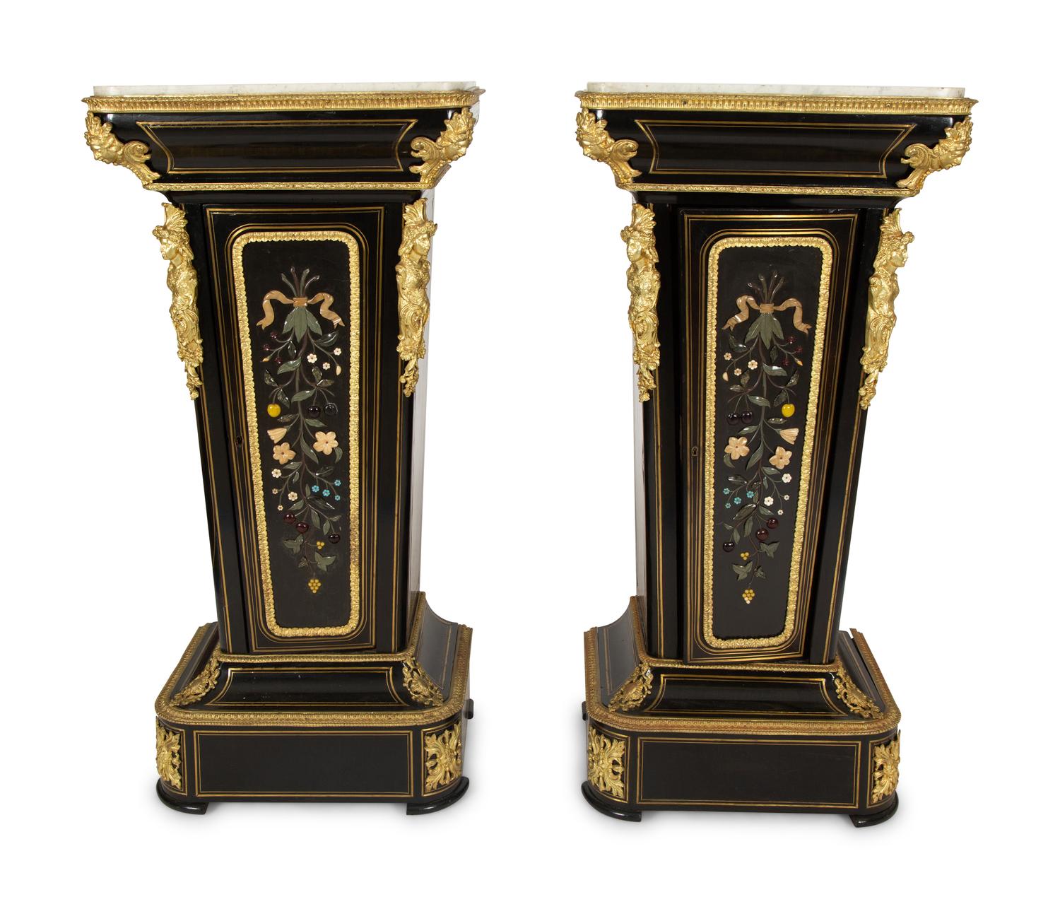 A Pair of Louis XVI Style Gilt-Bronze Mounted and Hardstone Inlaid Ebonized Marble-Top Pedestal Cabinets