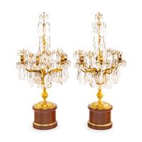 A Pair of Régence Style Rock Crystal, Cut Glass and Engraved Gilt Bronze Six-Light Candelabra on Simulated Porphyry Bases