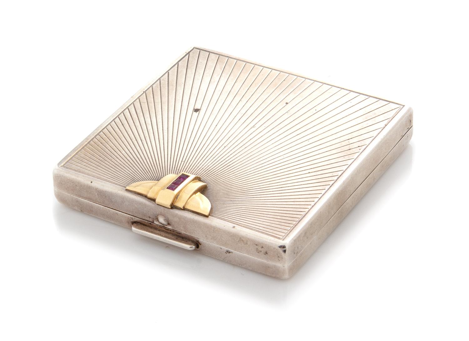 An American Silver 14-Karat Gold and Ruby Inset Compact, Maker's Mark WAB, First Half 20th Century, the lid with a gold and ruby appliq