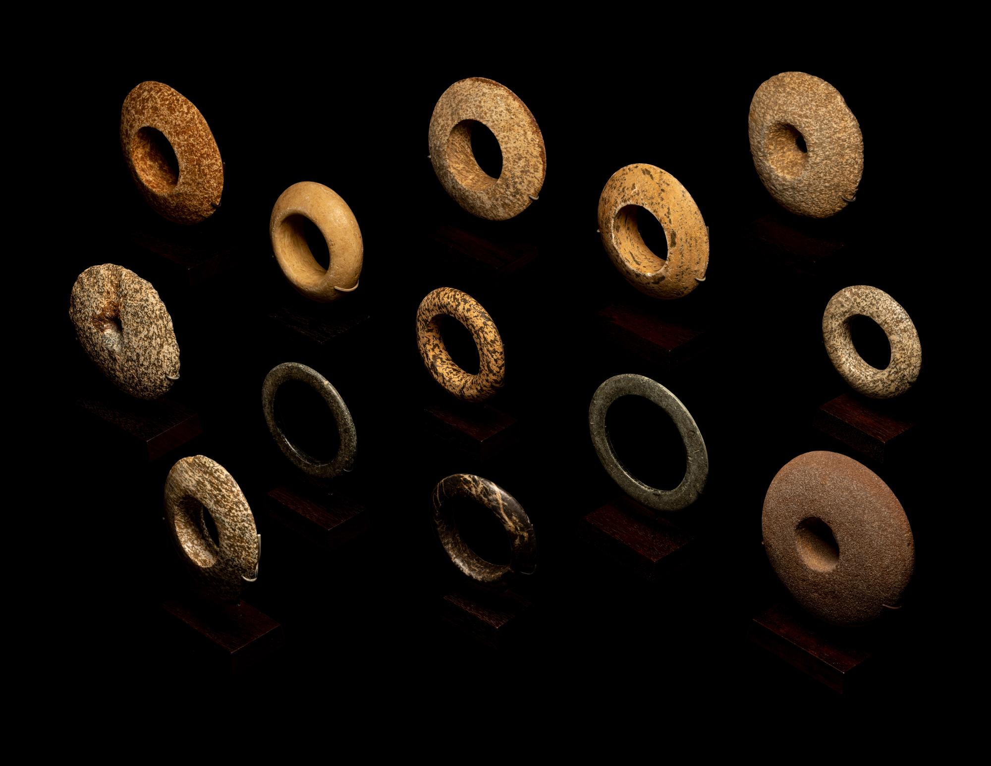 Thirteen Saharan Stone Bracelets and Discoidals