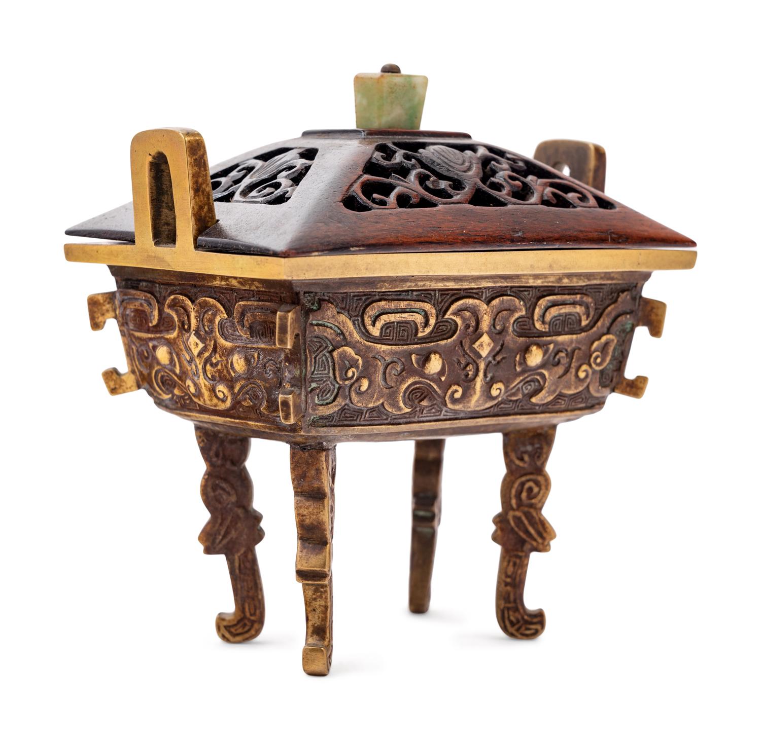 A Chinese Parcel-Gilt Bronze Ding- Form Incense Burner