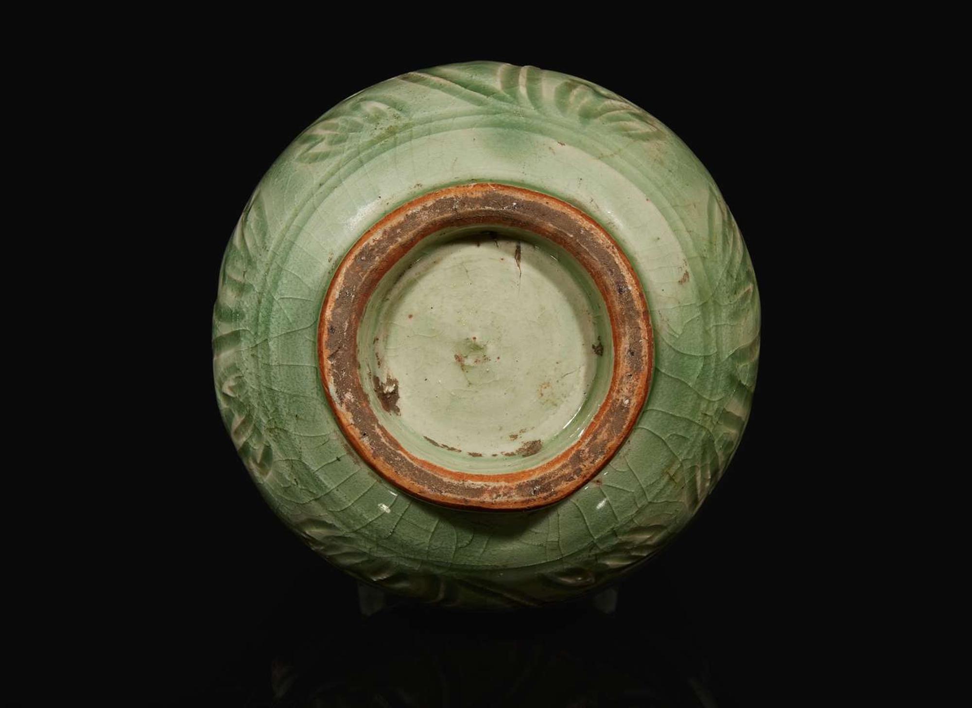 A Chinese celadon-glazed peony-incised vase, Ming to Qing dynasty 青釉刻劃牡丹瓶 明或清