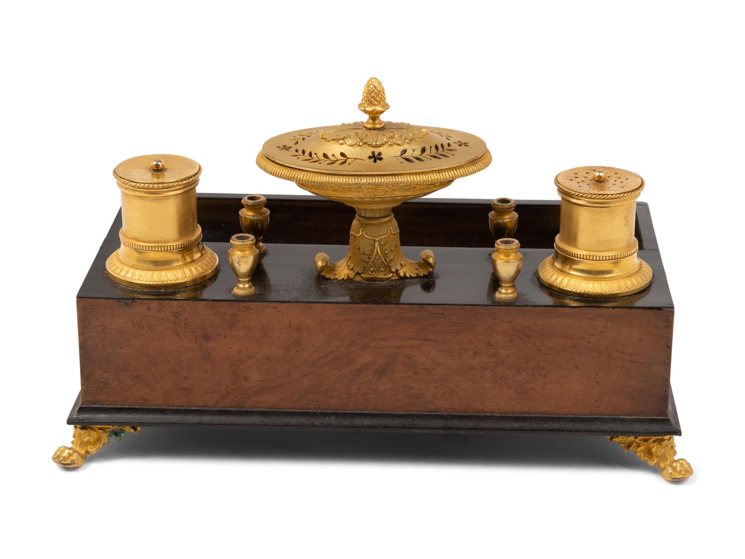 A French Gilt Bronze and Parcel Ebonized Burlwood Encrier