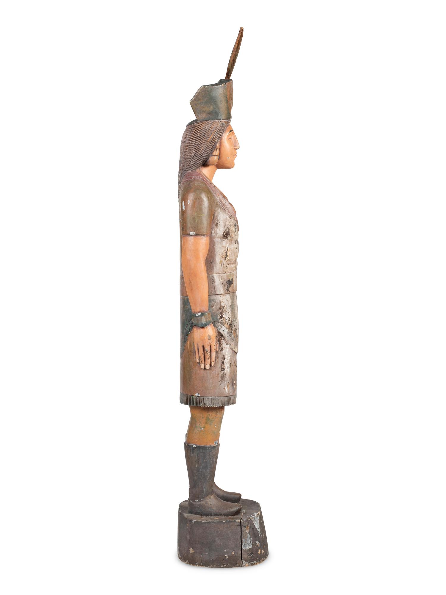 A Folk Art Carved and Painted Pine Native American Cigar Store Figure