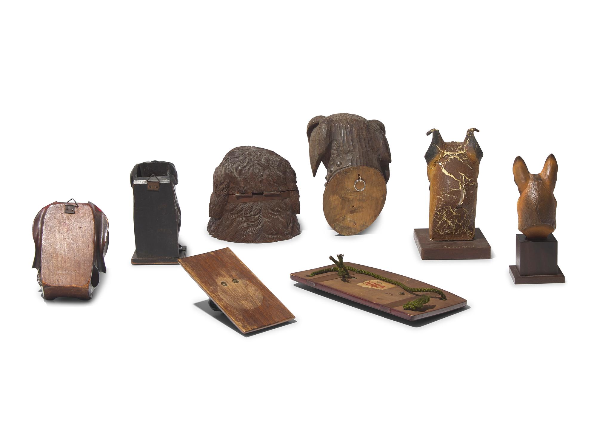 A Collection of Eight Dog-Form Carved Wood, Cast Plaster or Composite, and Cast Metal Articles