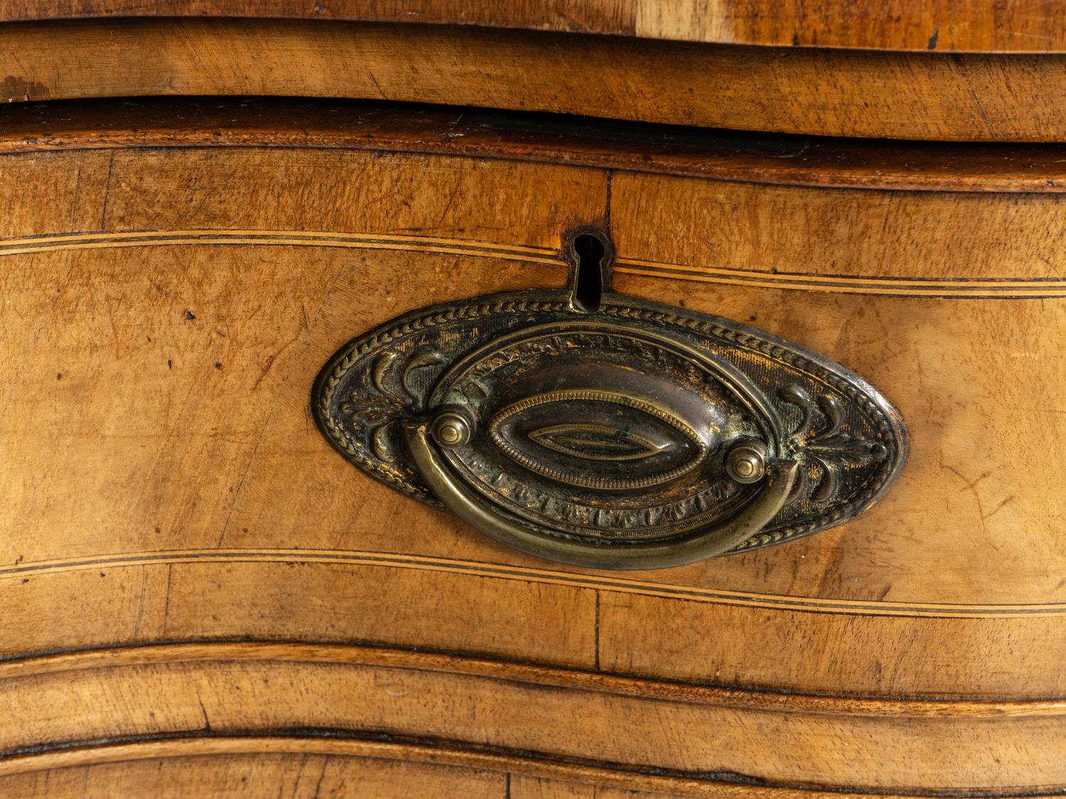 A George III Walnut and Mahogany Serpentine Sideboard