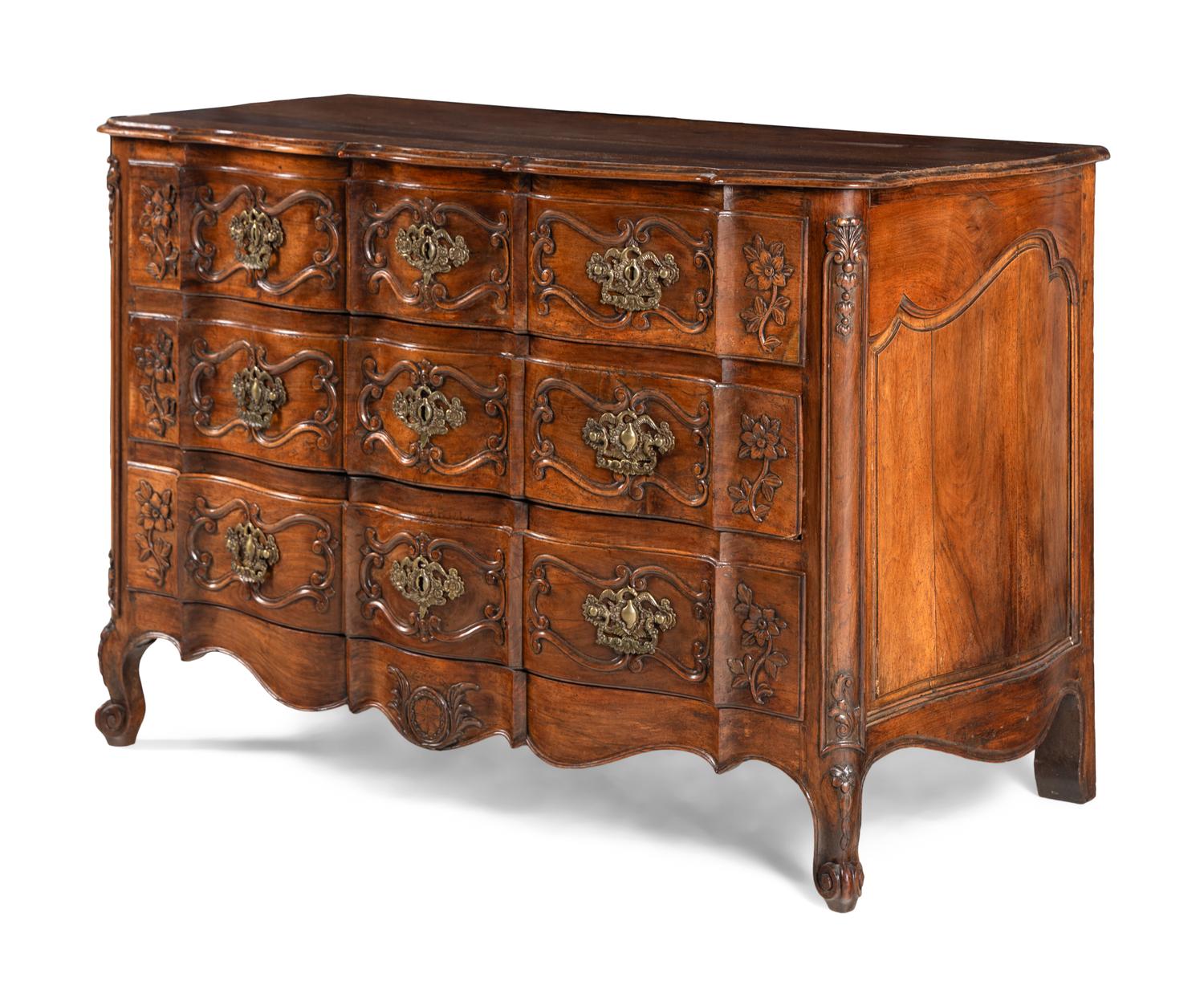 A Louis XV Walnut Serpentine Front Commode