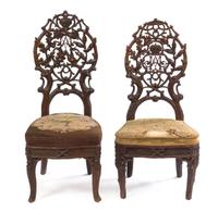 A Pair of Black Forest Pierce Carved Side Chairs Height of tallest 41 1/4 inches. — 19TH CENTURY