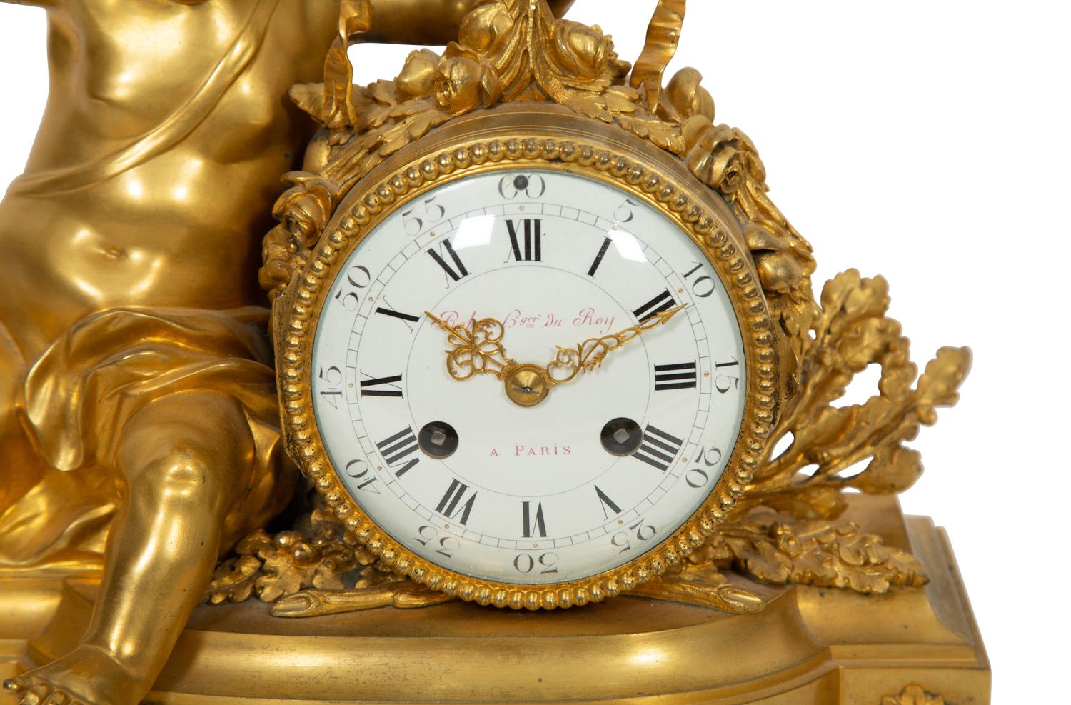 A Louis XVI Style Gilt Bronze and White Marble Mantel Clock