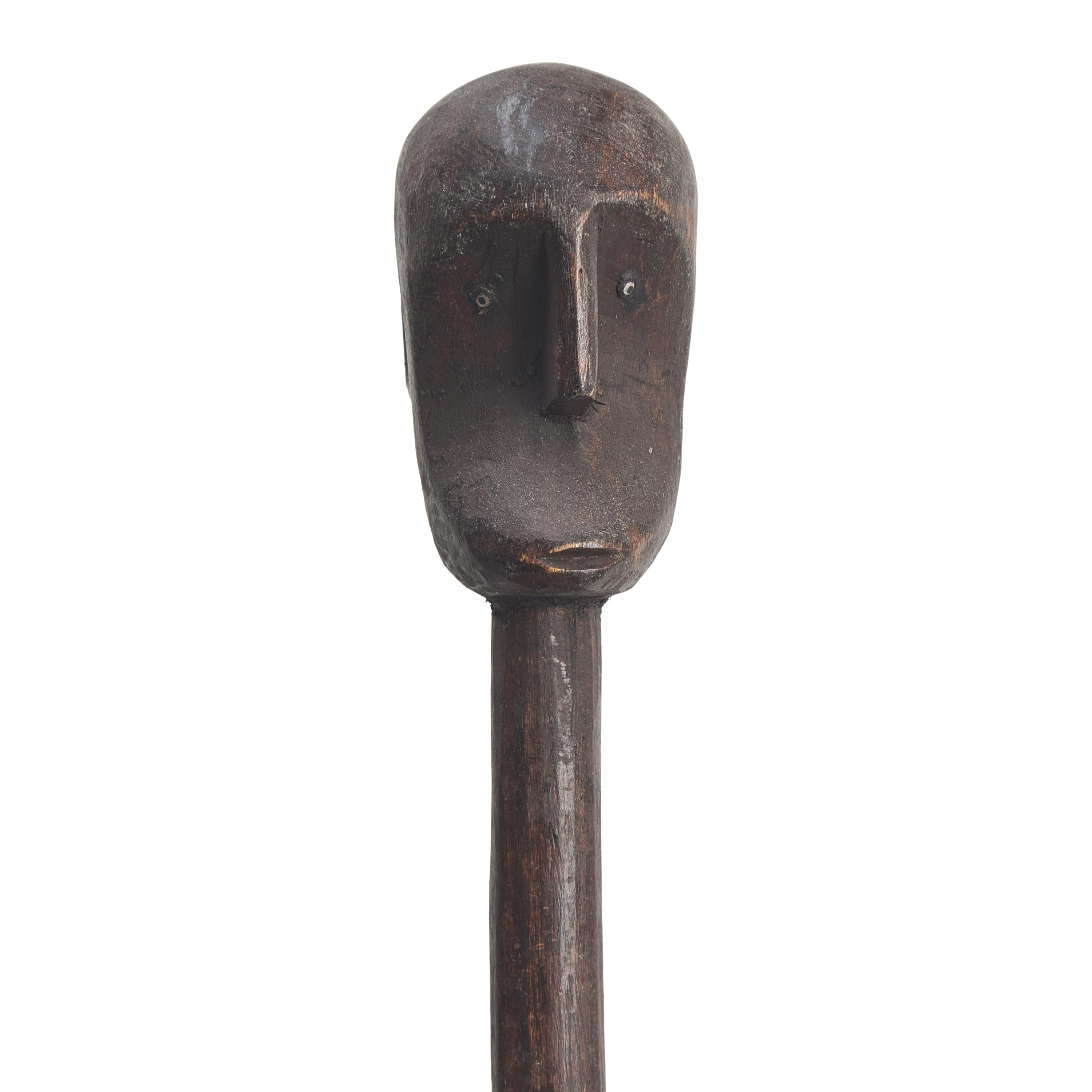 An African Carved Wood Sculpture on Stand